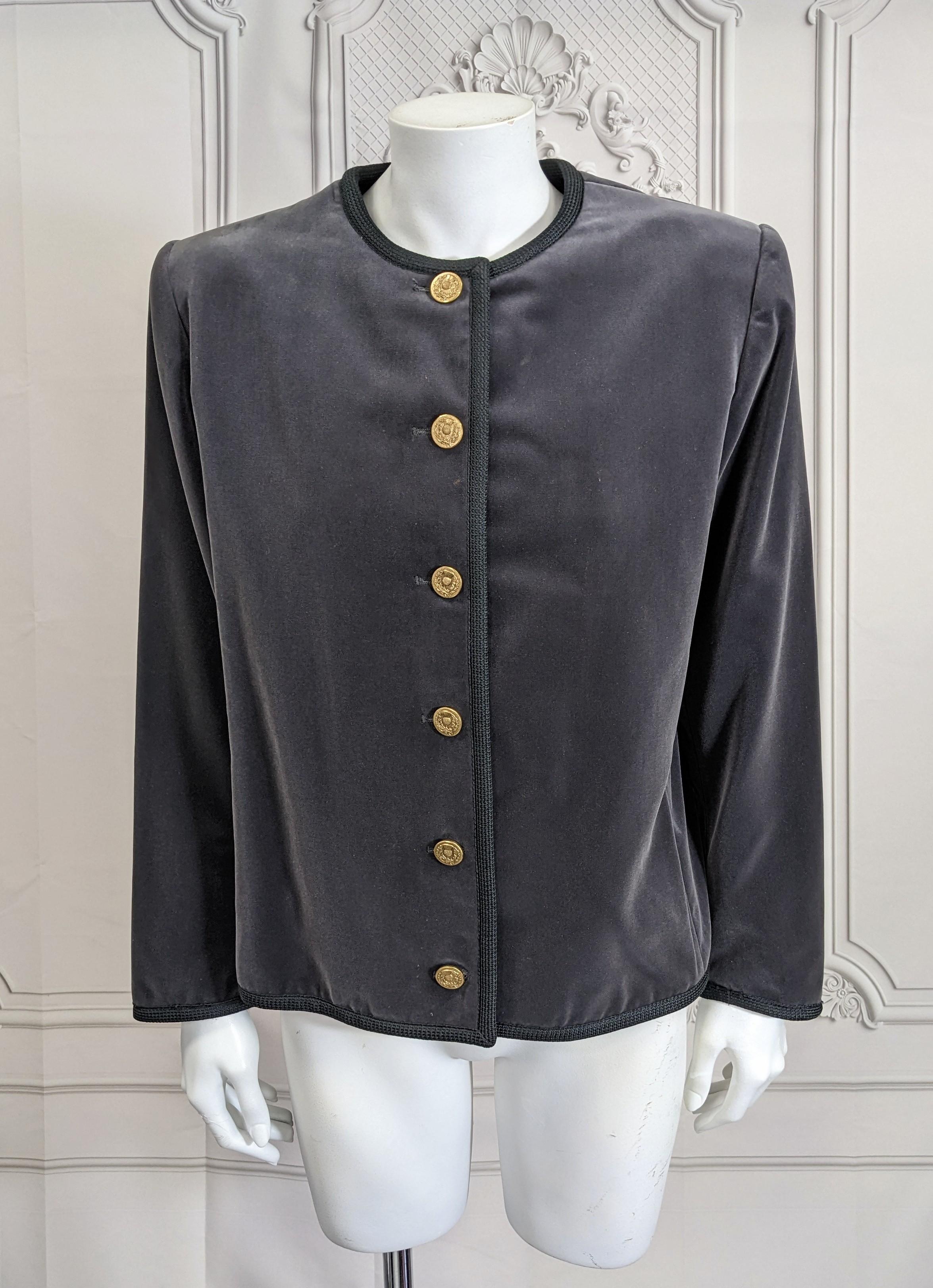Yves Saint Laurent Gray Velvet Jacket bound in black braid and gilt thistle buttons. Strong shoulders with square cut form. Classic wardrobe staple. 1970's France. Russian Collection. 
Vintage size 42. 