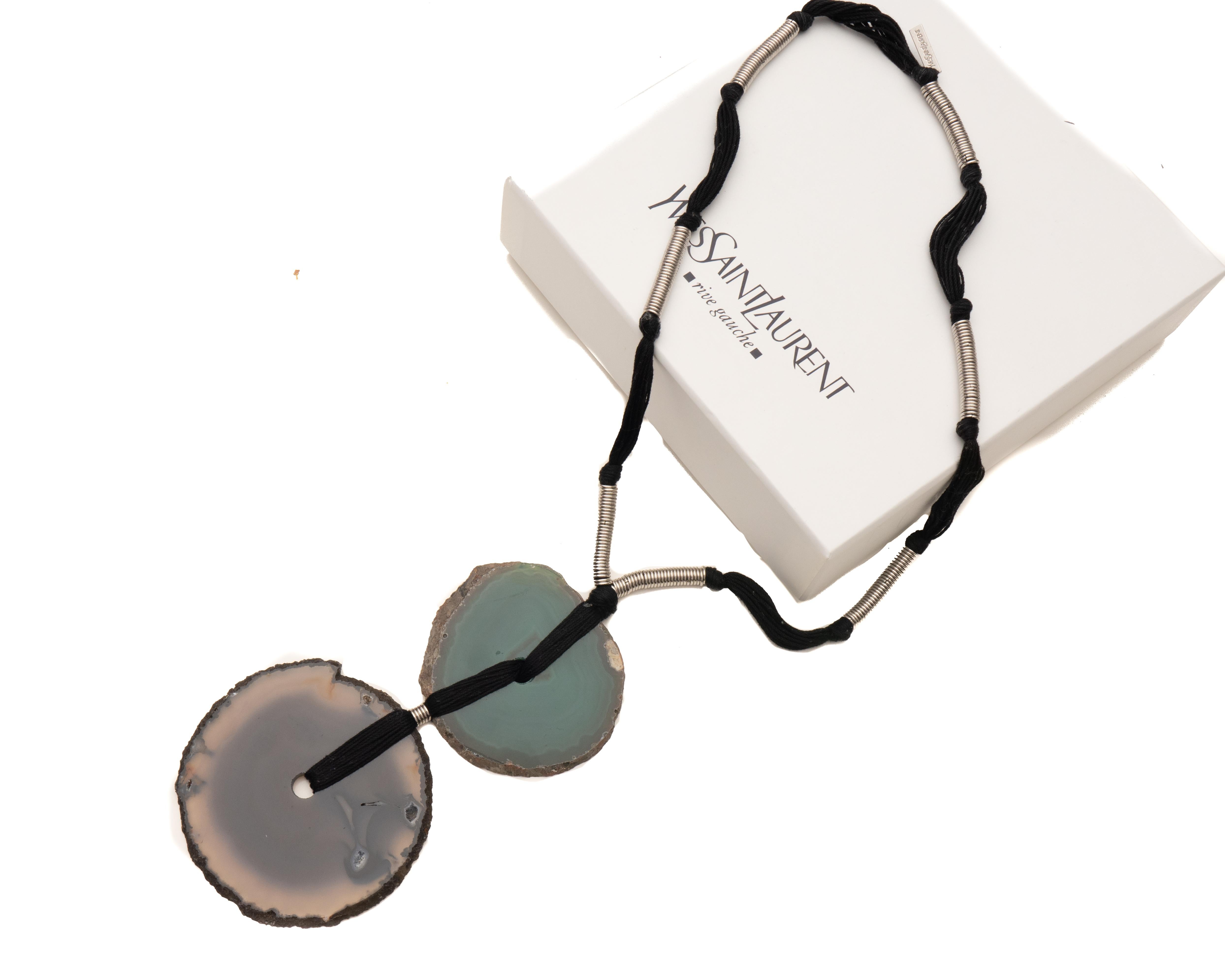 Necklace Details:
Yves Saint Laurent (YSL), Iconic Designer
Circa 1990s, Couture Line
Features Brown and Green Agate 
24 Inches in length 
Black and Steel Necklace 
Comes with Original Box 

