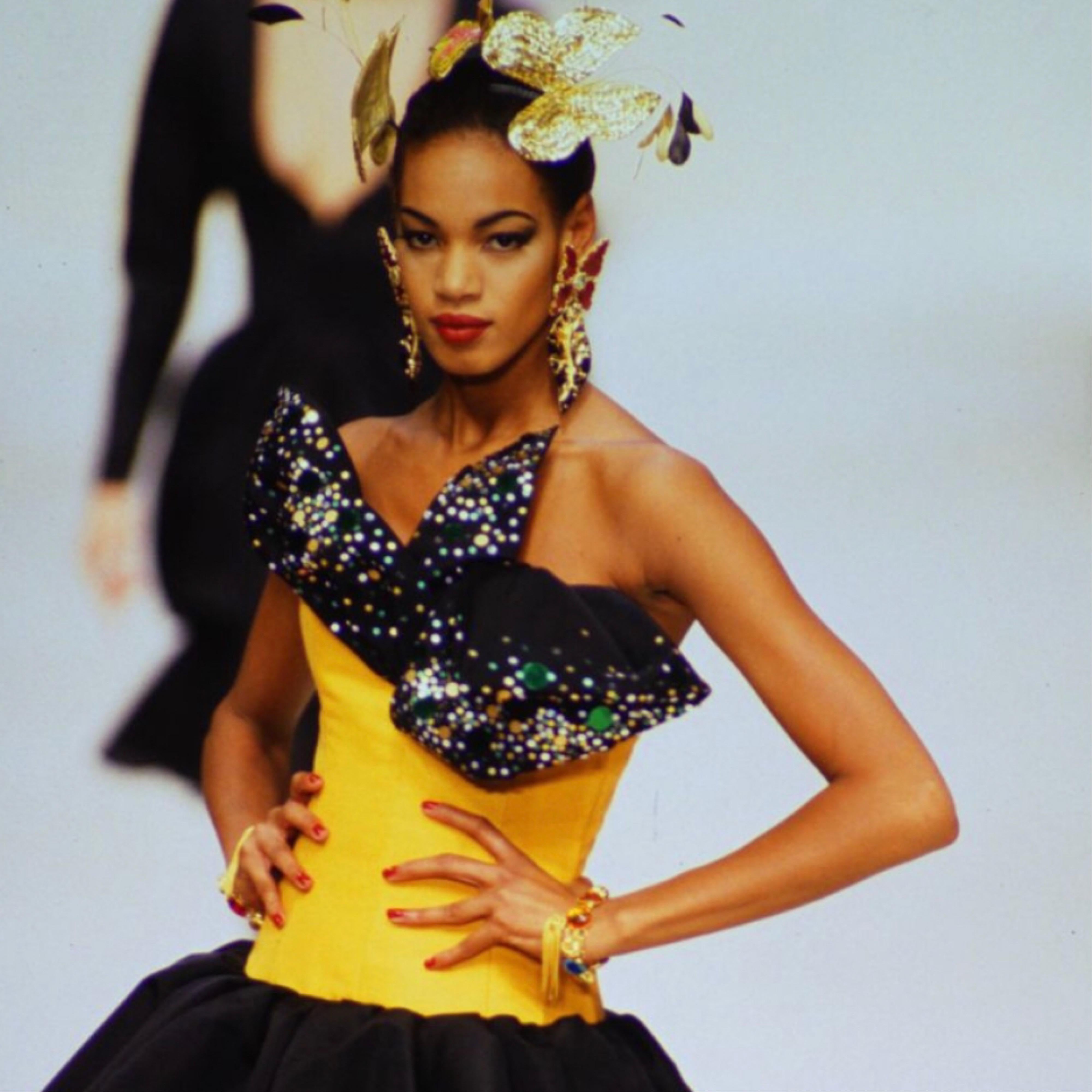 Yves Saint Laurent’s Spring/Summer 1993 collection was a spectacular carnival of color with an underlying garden theme. Artistic hats, vibrant fabrics, and of course, stunning statement jewelry to take every look to the next level. From that