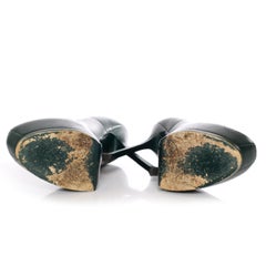Yves Saint Laurent, Green leather Tribtoo platform pumps.