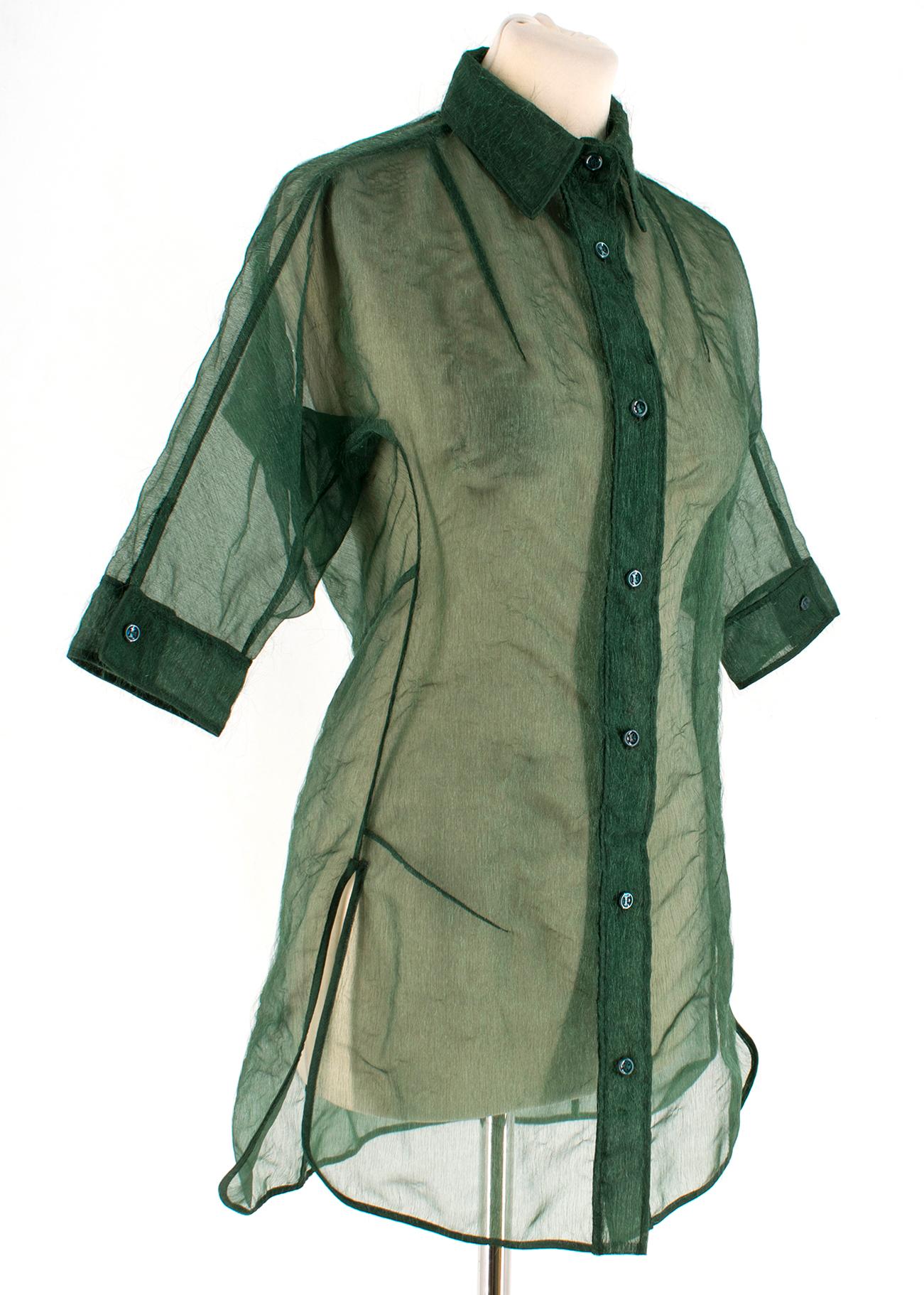 Yves Saint Laurent Rive Gauche Green Fitted Organza Blouse with fraying effect

- Made in France

Please note, these items are pre-owned and may show signs of being stored even when unworn and unused. This is reflected within the significantly