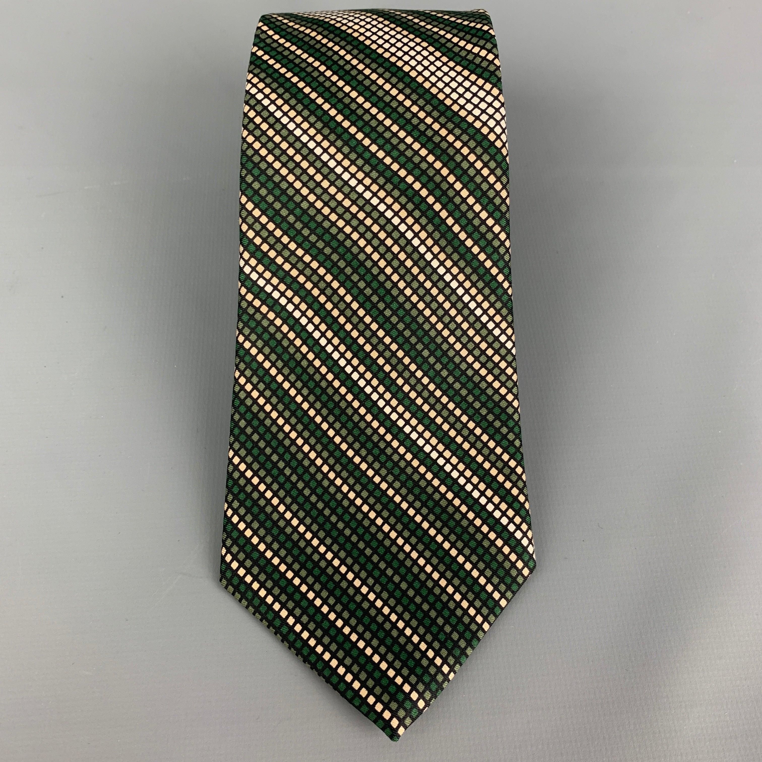 YVES SAINT LAURENT
 necktie comes in a green & white silk twill with a all over checkered print. Very Good Pre-Owned Condition.Width: 3.25 inches 
  
  
  
 Sui Generis Reference: 117583
 Category: Tie
 More Details
  
 Brand: YVES SAINT LAURENT
