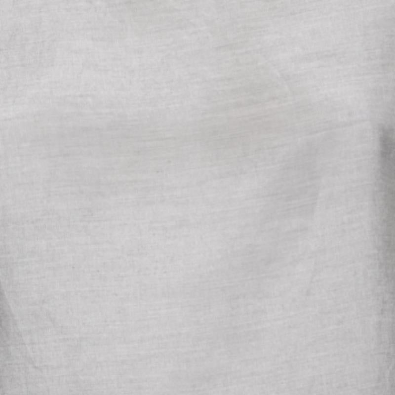 Minimal yet classy, this top from Yves Saint Laurent exudes elegance in every way! It is designed using grey silk cotton fabric and displays a rounded neck and hook closure. Pair this top with black pants and heels for a sophisticated look.