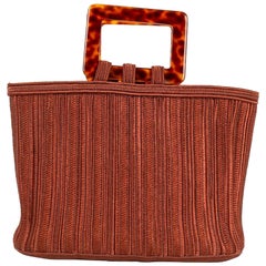 Bolso Yves Saint Laurent con asa de baquelita