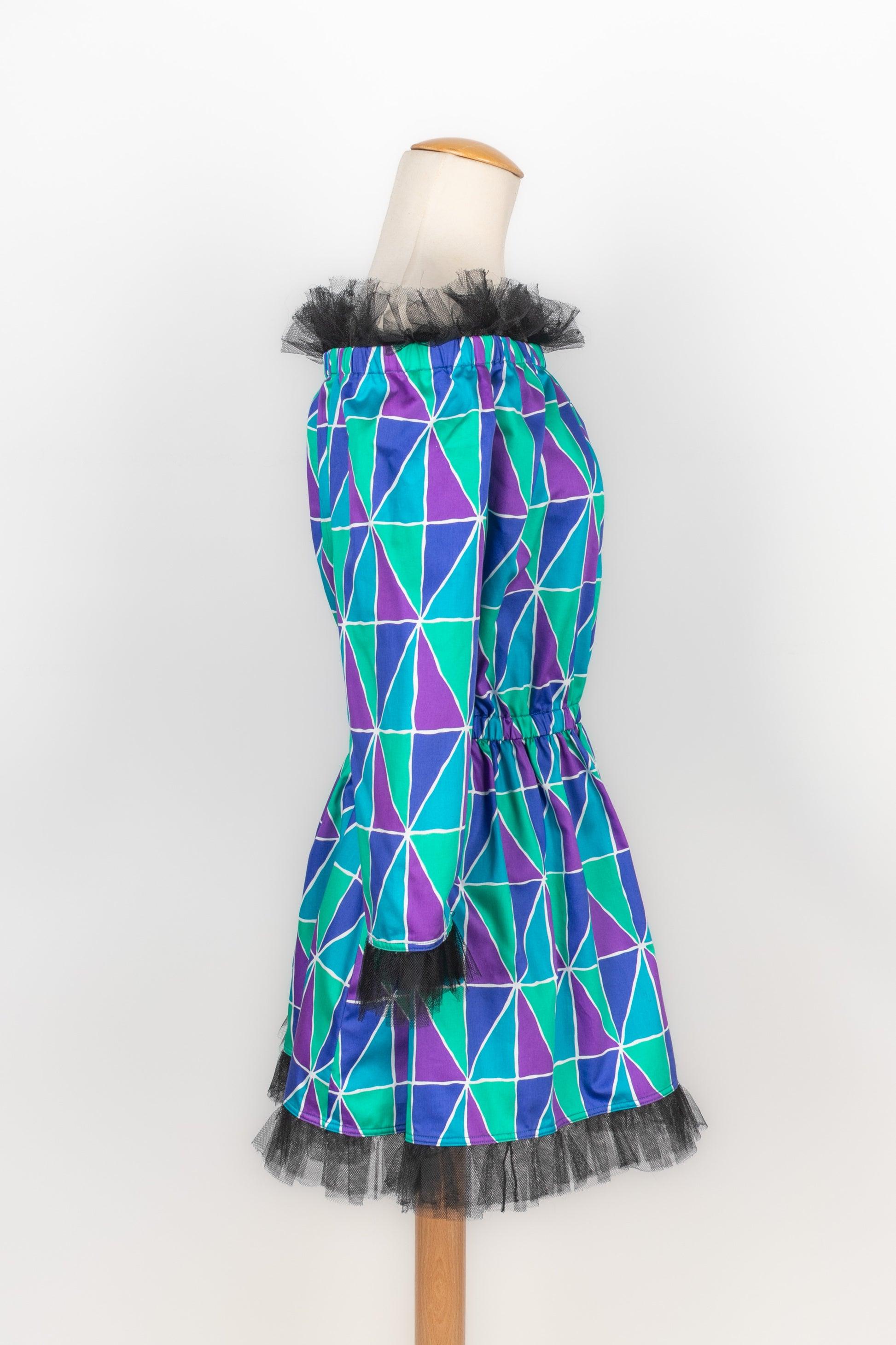 Yves Saint Laurent - (Made in France) Cotton mini dress printed with purple, blue, and green harlequin pattern. Size 40FR indicated. 1988 Spring-Summer Collection.

Additional information:
Condition: Very good condition
Dimensions: Chest: 50 cm -