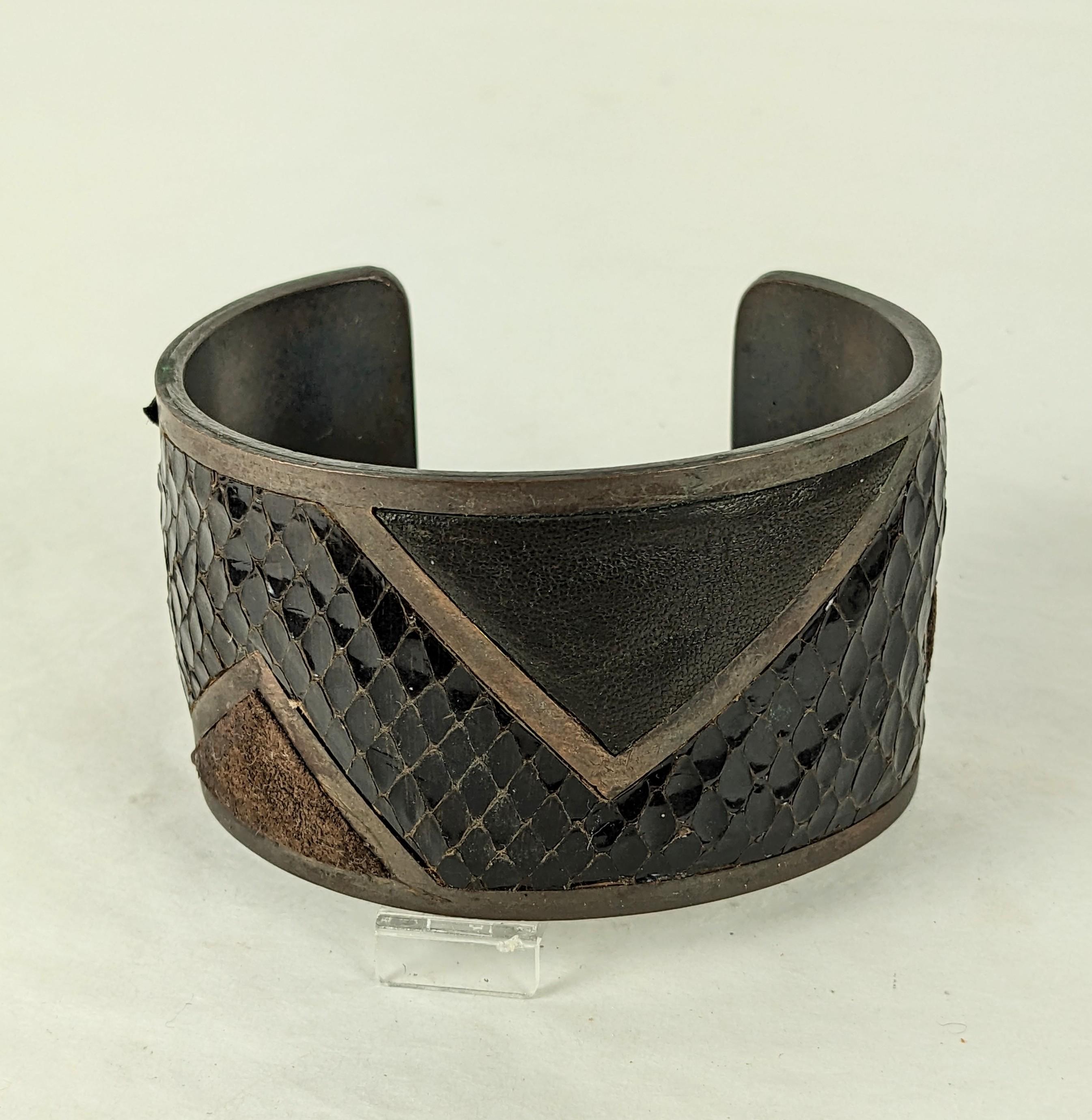 Super Chic Yves Saint Laurent Haute Couture 1980 Cuff Bracelet. Art Deco styling in darkened copper over bronze with padded snakeskin, suede and calf leather. 3 different textures beautifully underlaid with padding so each is dimensional. Chic black