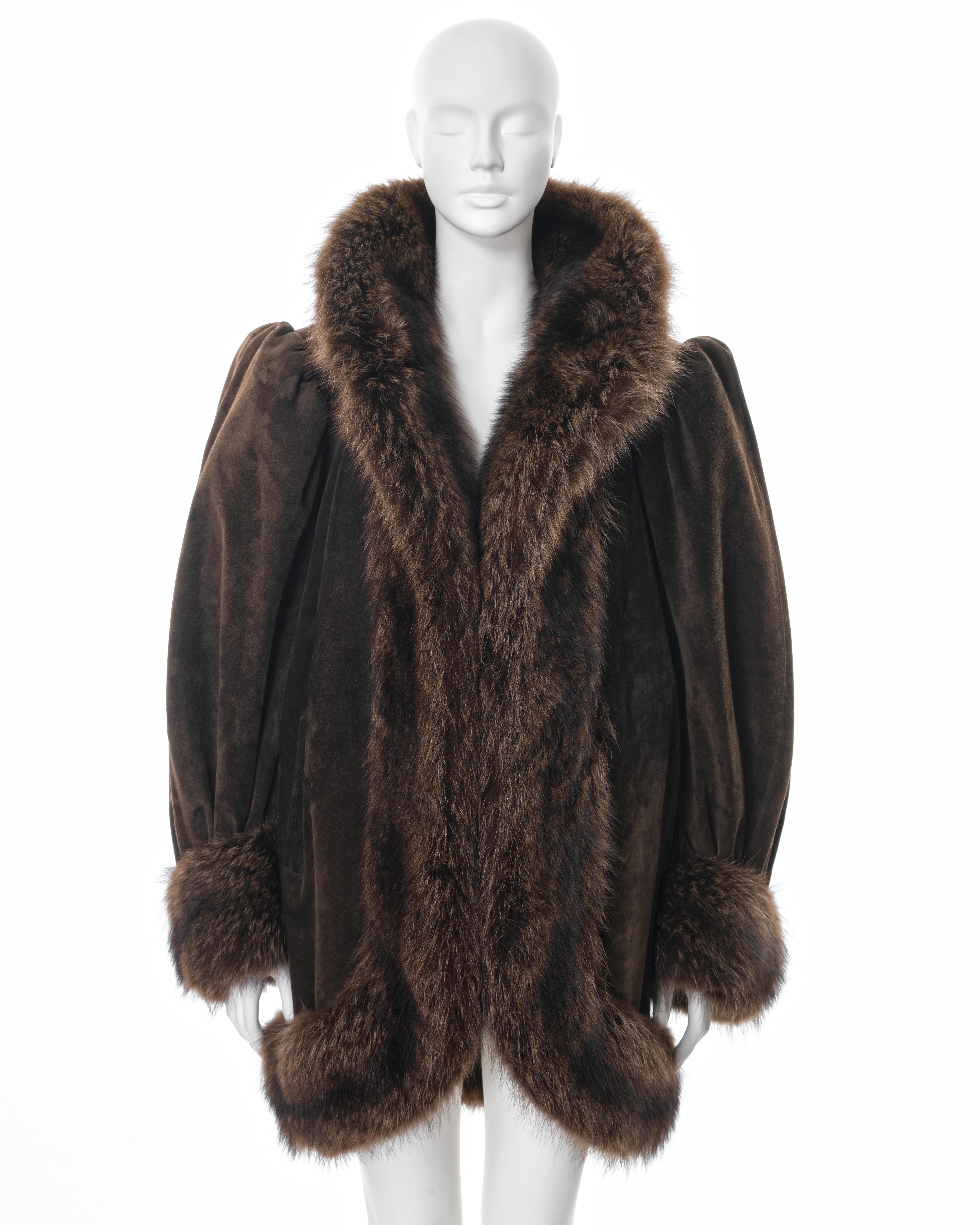 ▪ Yves Saint Laurent Haute Couture cocoon coat 
▪ Sold by One of a Kind Archive
▪ Fall-Winter 1983 
▪ Constructed from brown suede 
▪ Beaver fur trim 
▪ Oversized fit 
▪ Structured shoulders 
▪ Silk lining 
▪ Size approx. Medium 
▪ Made in