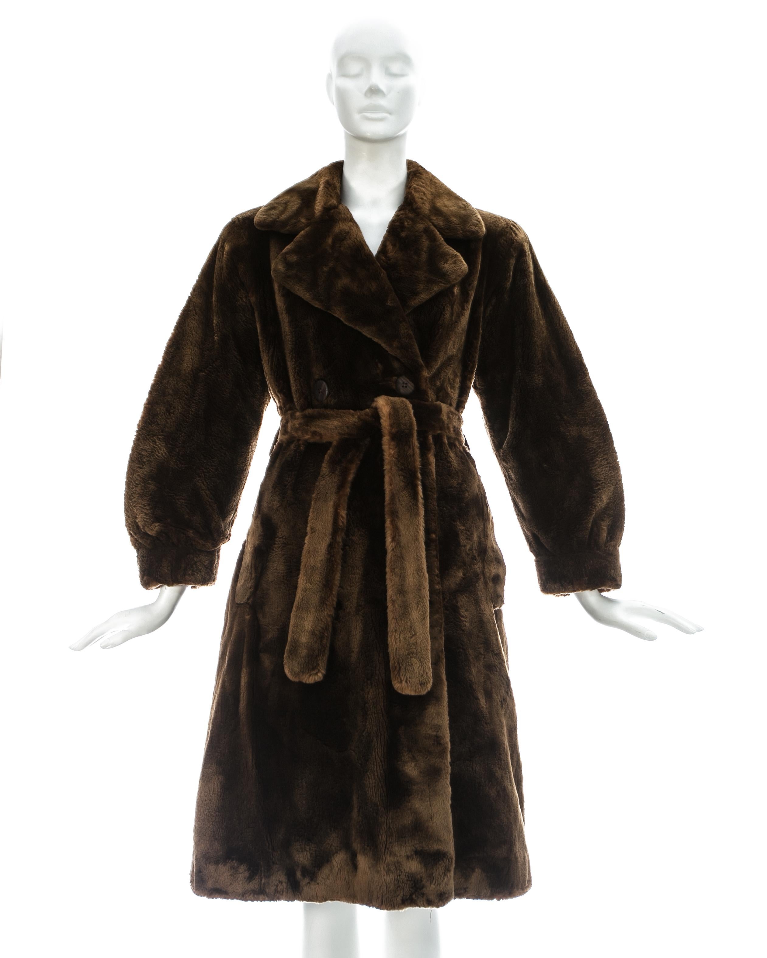 Yves Saint Laurent; chestnut brown sheared beaver fur coat with structured shoulders, silk lining, wooden buttons and matching belt. 

Haute Couture Fall-Winter 1985 