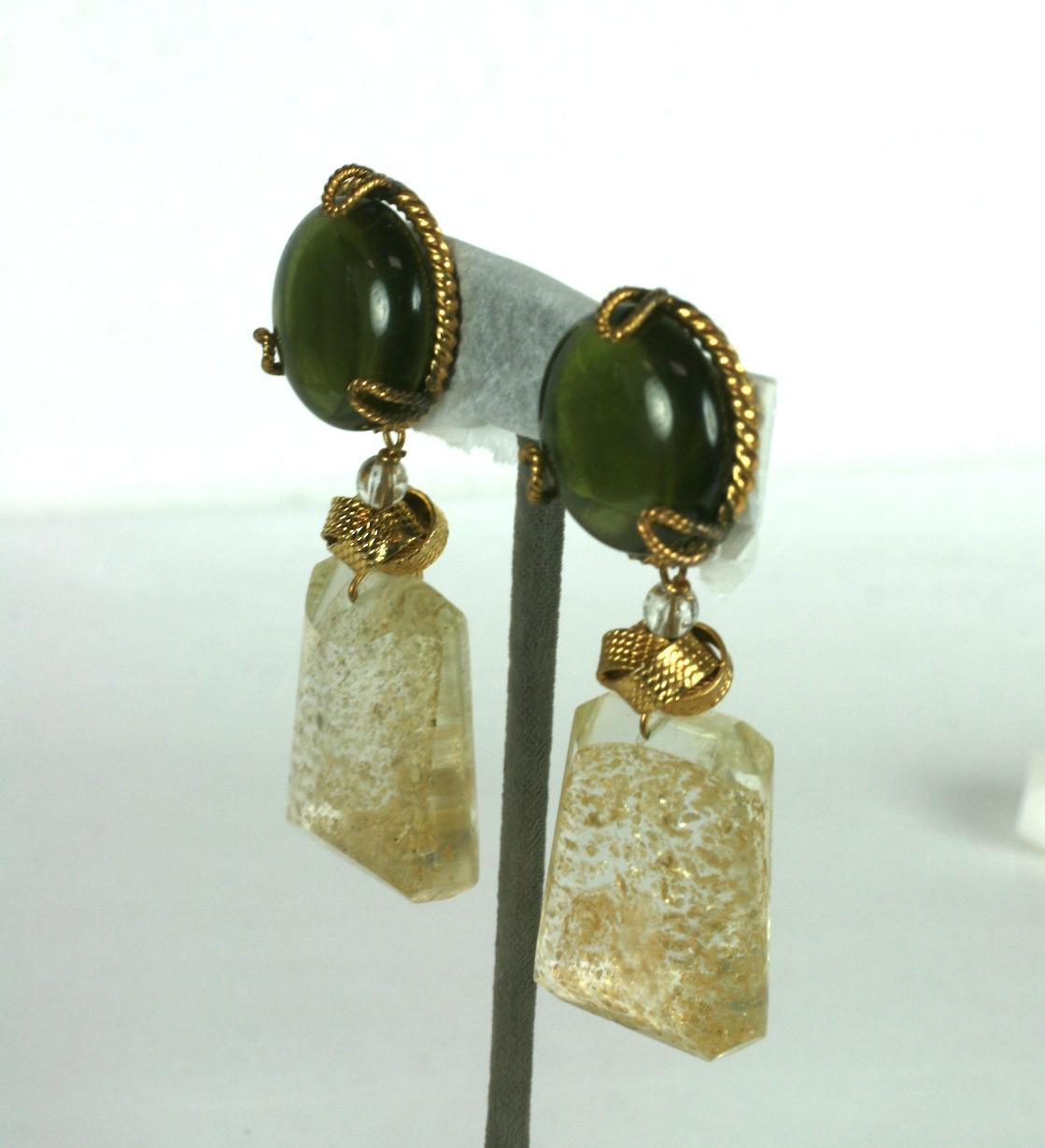 Yves Saint Laurent Haute Couture Chinese Collection ear clips  Of olive pate de verre with gold flecked quartz with gilt bronze knot and twisted wire surround. Clip back fittings.
Unsigned Haute Couture YSL. 
Excellent Condition
Length  3