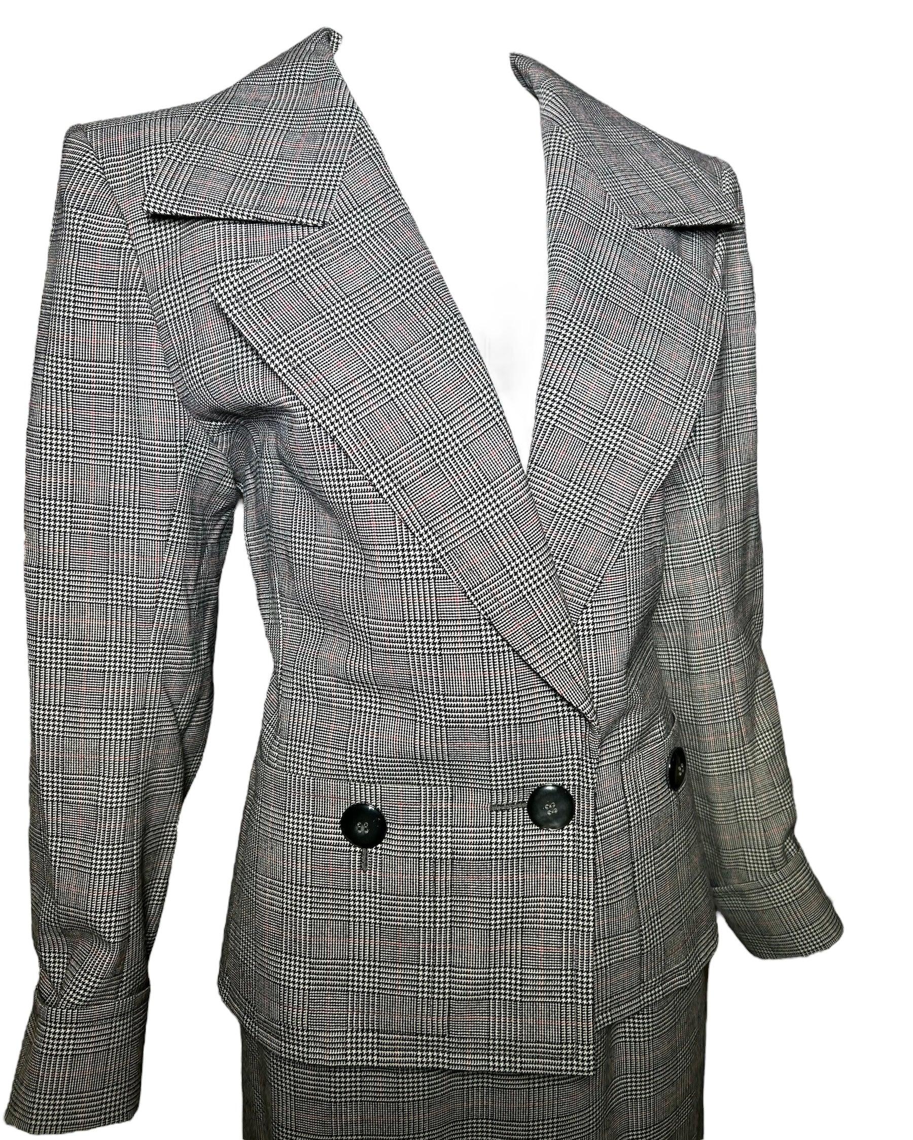 Yves Saint Laurent 80s Haute Couture Houndstooth Ensemble.  Incredible shoulder padded classic 80s power suit. Oversized sleeves. Houndstooth. Two functioning pockets on either side closed by button. One jacket button. Skirt features side zipper and
