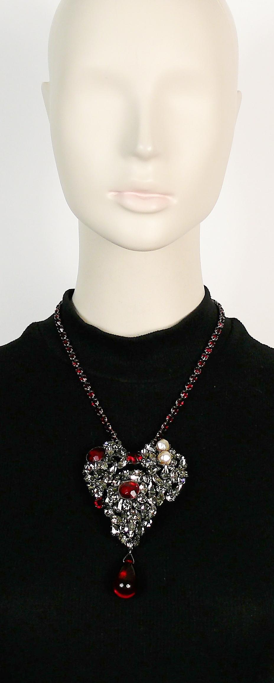 YVES SAINT LAURENT Haute Couture iconic necklace featuring a bejeweled heart embellished with faux diamonds, rubies and pearls with ruby rhinestone chain.

The heart can be worn as a brooch.

Hook clasp closure.
Adjustable length.

Embossed YSL