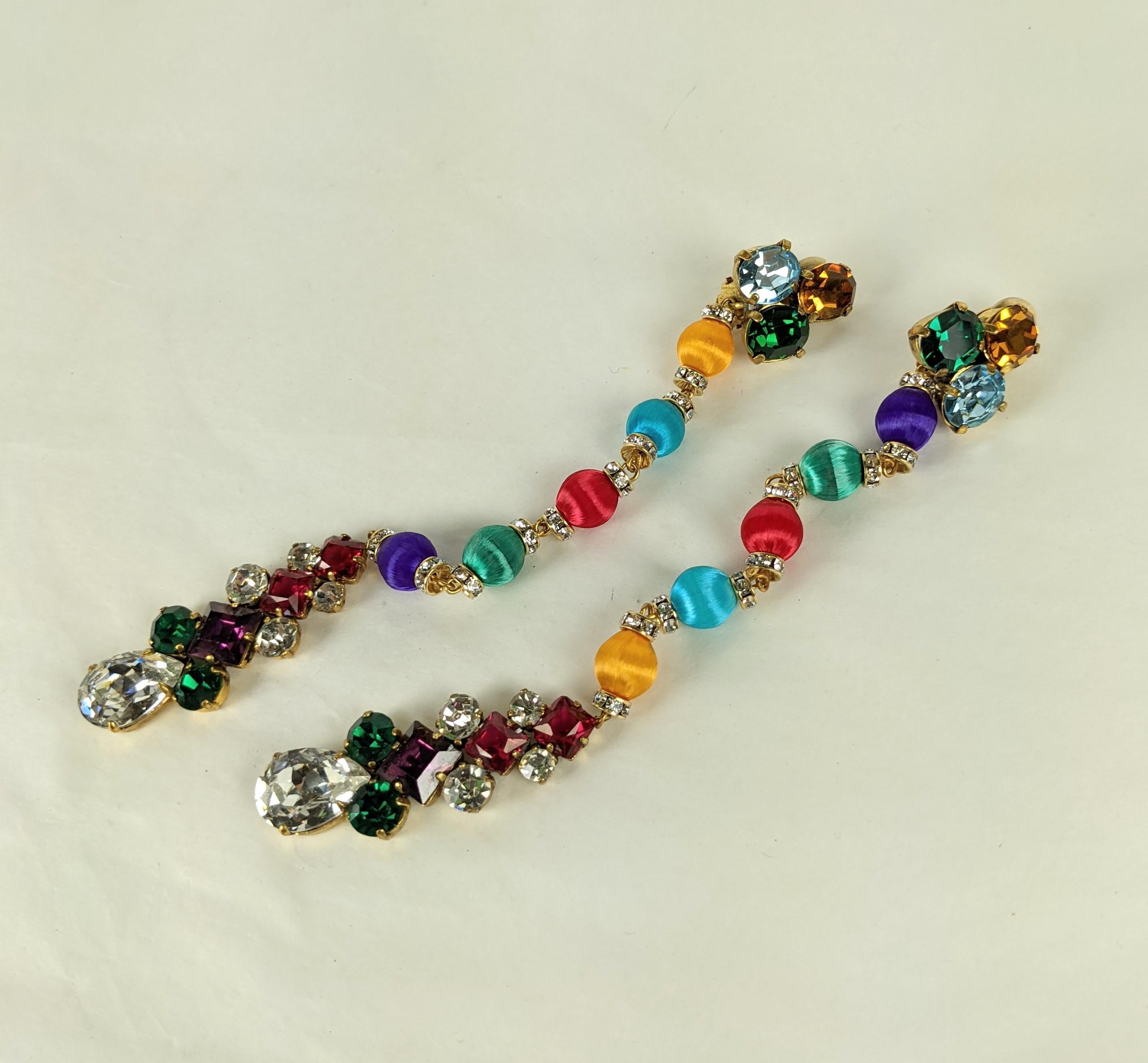 Yves Saint Laurent  Haute Couture rare long earrings. Composed of multi colored hand made   Passementerie silk beads, crystal rondelles and prong set Swarowski assorted gem colored faceted crystal rhinestones.
Excellent Condition, Unsigned, L 7.25