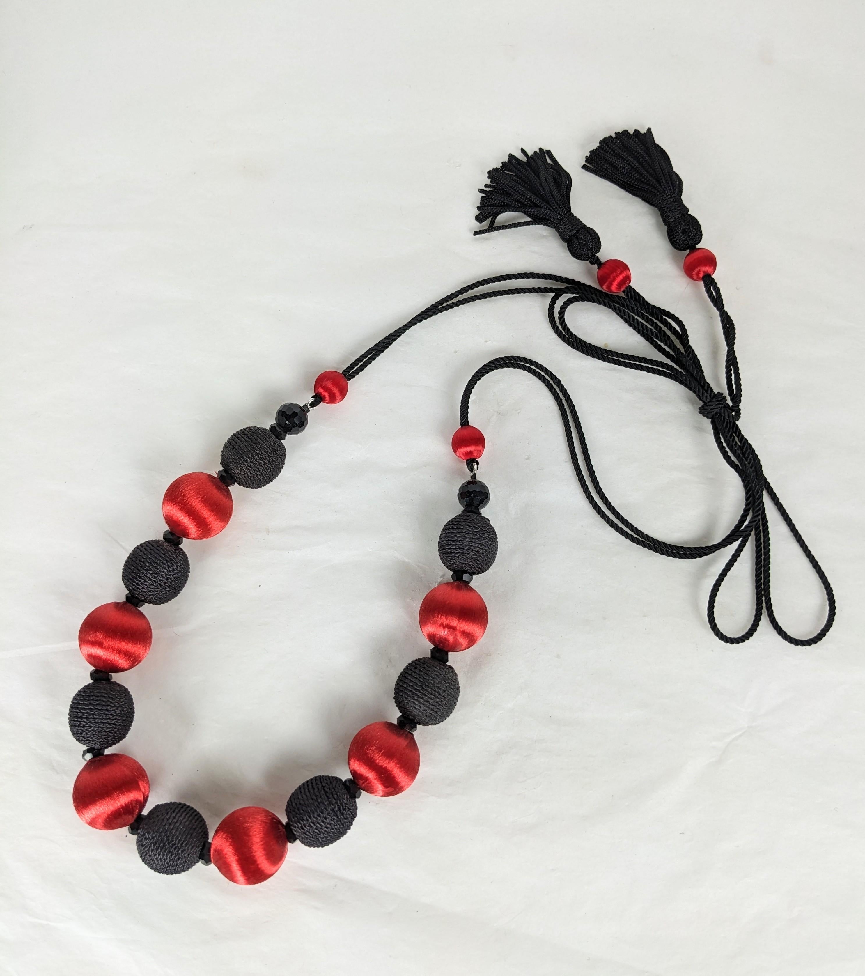 Yves Saint Laurent  Passementerie Necklace, Haute Couture Spring Summer 1977 Spanish Collection. Composed of silk cord with tassel ends. Black faceted jet crystal beads and black corded soutache with red silk sateen large and small beads. Excellent