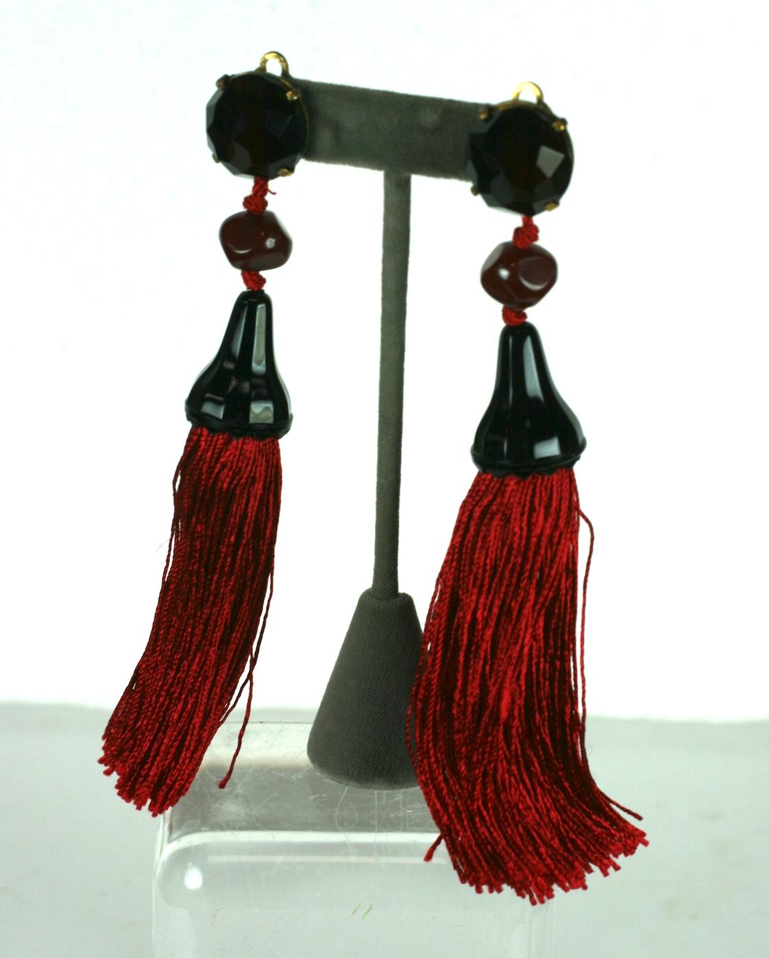Massive Yves Saint Laurent Haute Couture Tassel Earrings of ruby pastes, faux amber, faceted jet caps with ruby silk tassels. Clip back fittings. 1970's Haute Couture unsigned. YSL Chinese Collection.
Earring tops are deep faceted ruby, not