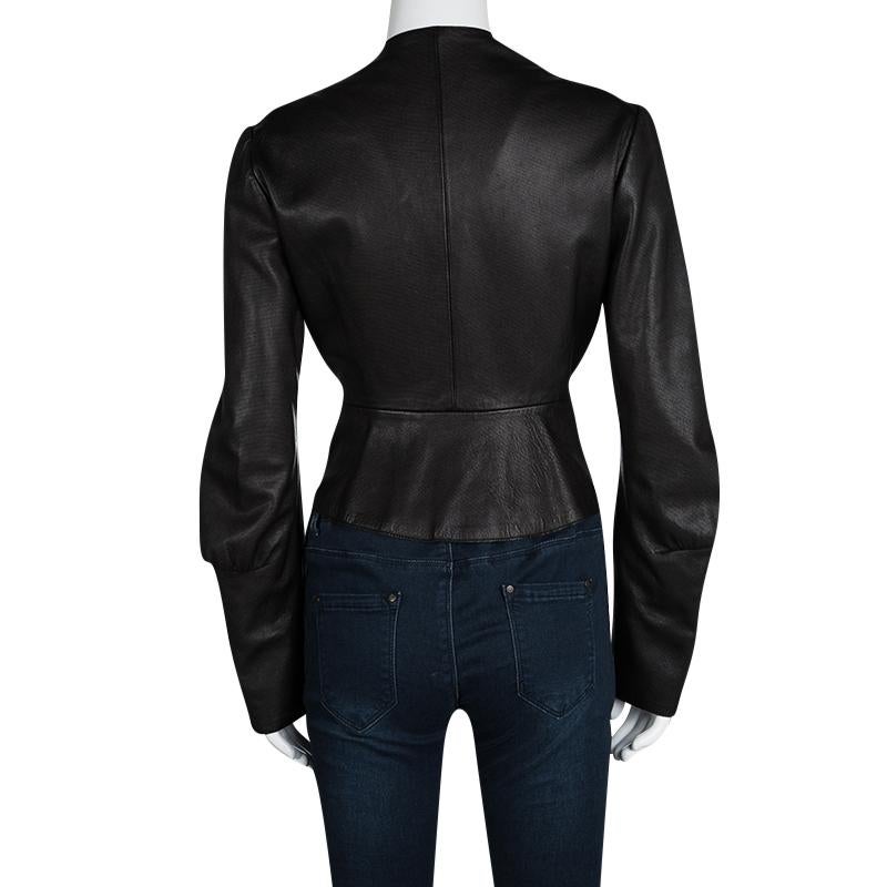 YSL’s leather jacket is such a rage! The Hiver’08 is cut from 100% genuine dark brown leather and has a flattering fit. Paneled front is embellished with gold-tone zipper front that runs along an asymmetric cut at the front. A peplum back adds to