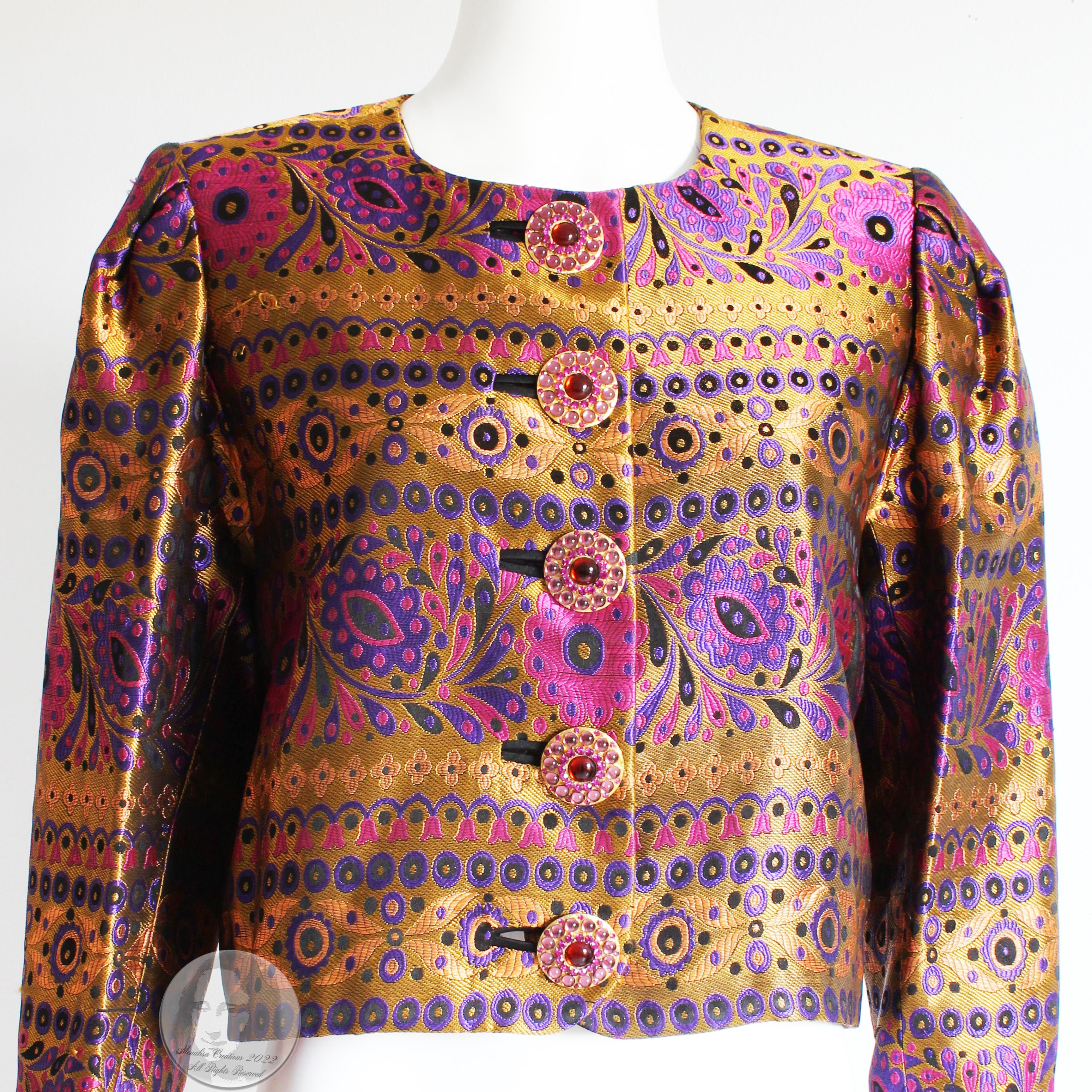 An incredible vintage jacket by Yves Saint Laurent from the F/W 1991 collection.  Made from what we believe is silk (no content label), this fabulous jacket features a gorgeous floral brocade in shades of gold, lilac, black and pink and fastens with