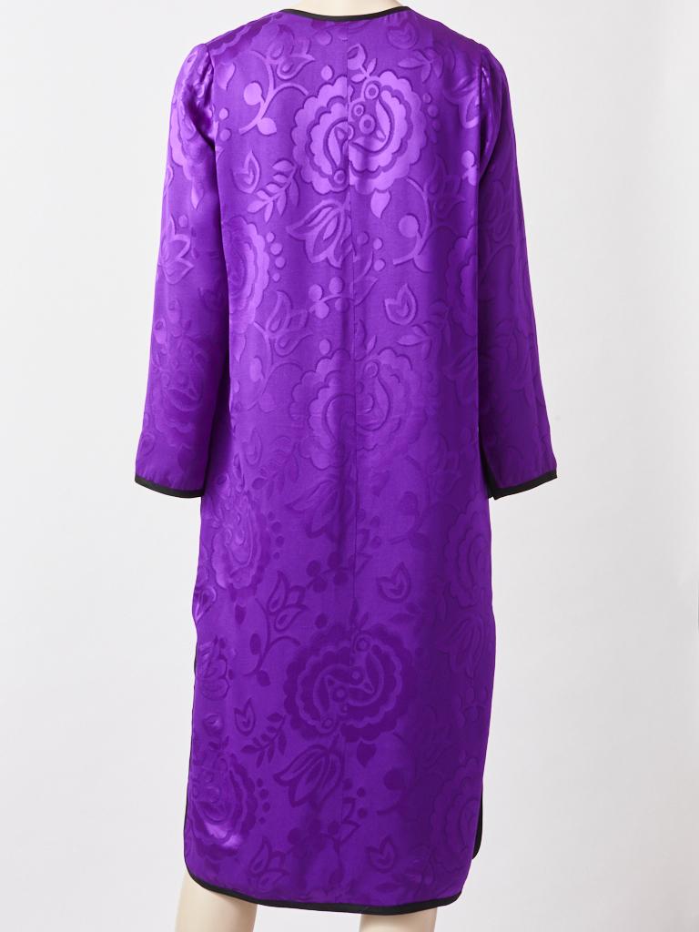 Yves Saint Laurent, Rive Gauche, Chinese collection, long sleeve, shift in a purple jacquard having a jeweled neckline. with black passementerie trim  detail.