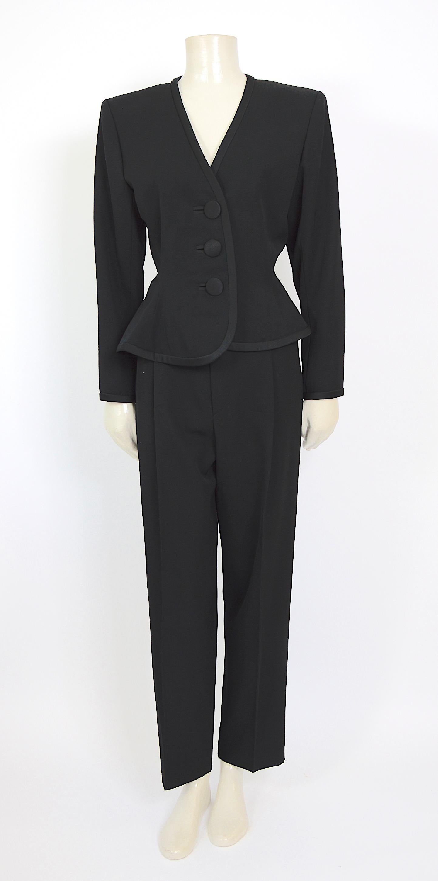 This vintage 1980s suit by Yves Saint Laurent, designed by Mr. Saint Laurent himself, is truly exceptional. It's a modern interpretation of the classic smoking suit, and the attention to detail is simply stunning.
Crafted from high-quality wool and