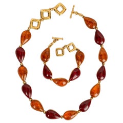 Yves Saint Laurent Gioielli Set di collana corta e bracciale in metallo dorato