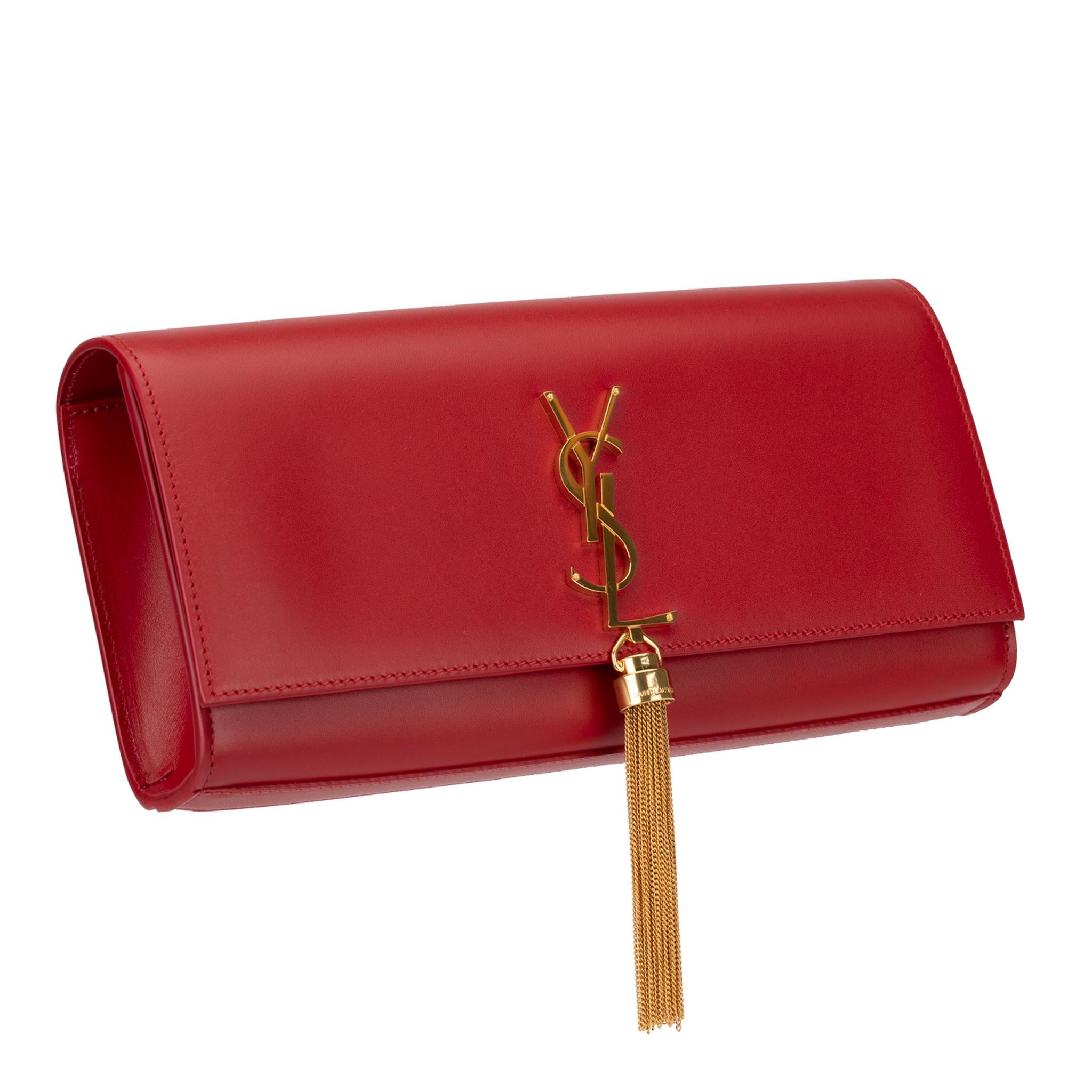 This Yves Saint Laurent Kate clutch is a chic evening accessory, crafted from Rouge smooth leather with gold hardware. Perfect for a night out, this piece is sure to add an elegant touch to any outfit.

Brand:

Yves Saint Laurent 

Product:

Kate