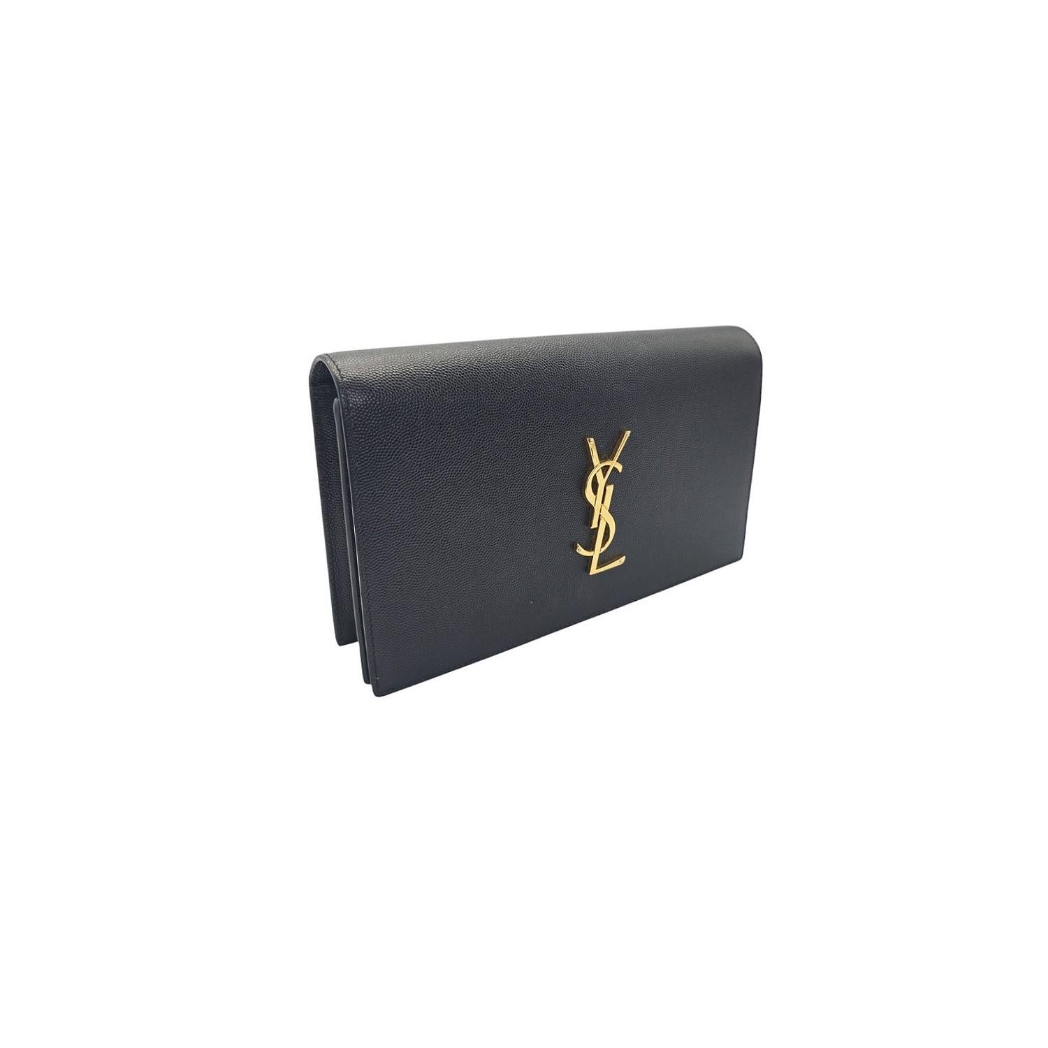 Explore timeless elegance with the Saint Laurent Kate Clutch. Crafted with black grained leather, this bag features a flap top with the iconic YSL logo medallion snap closure that opens to a fabric interior with a leather patch pocket. Trust in the