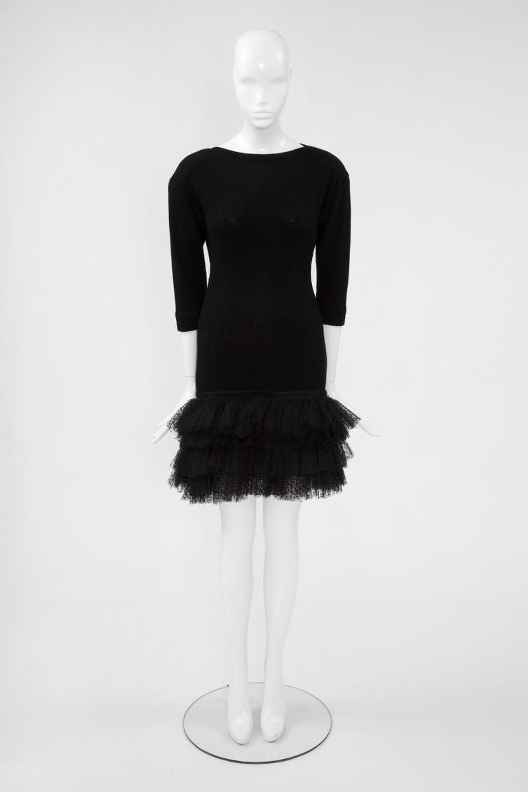 Anthony Vaccarello has dived into Saint Laurent's archives once more ! We can find a close inspiration of this original 80's dress in the current 2019 Fall-Winter collection (see pictures 13 & 14). Cut from ribbed knit wool, our slim-fit mini dress