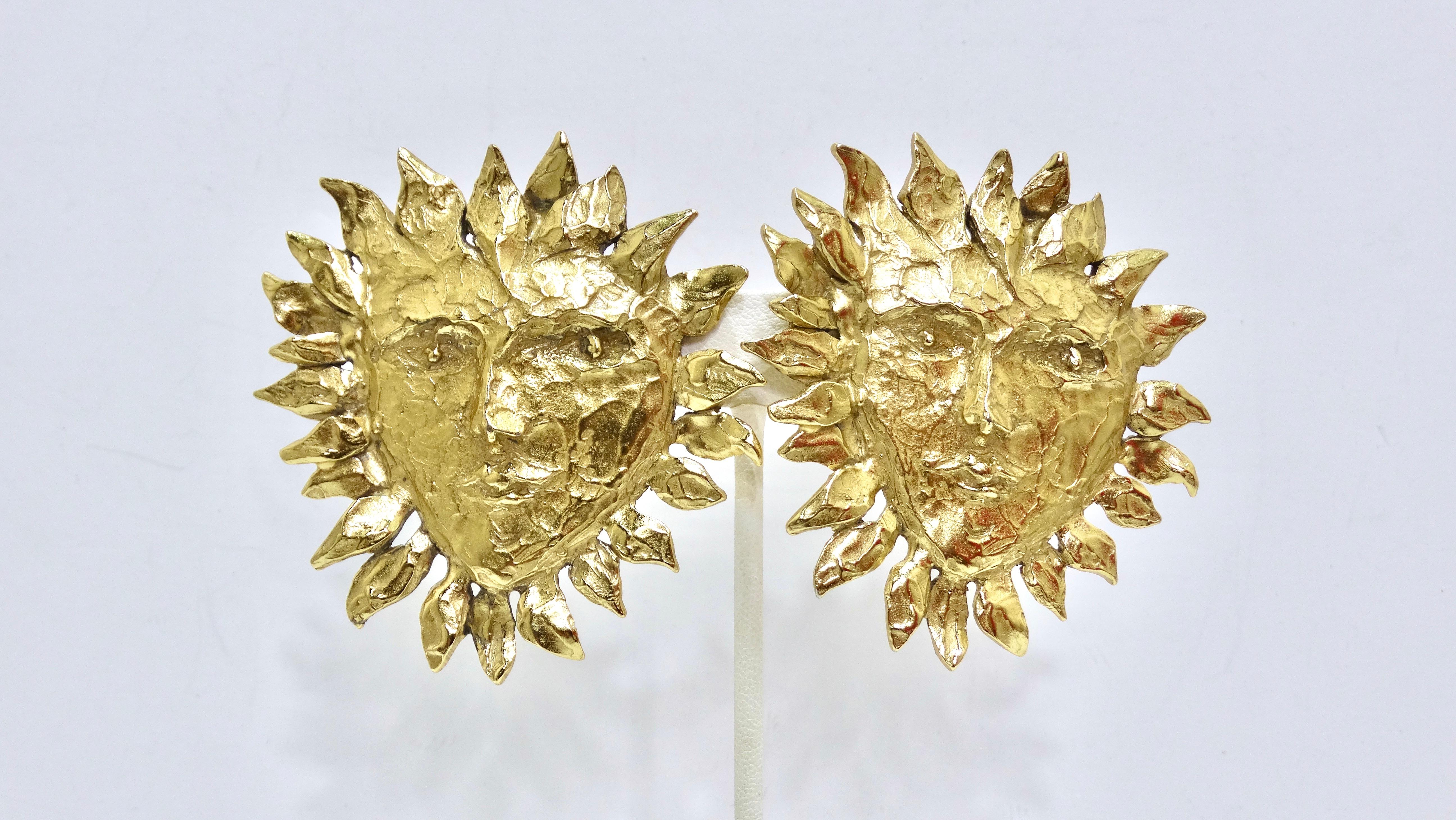 These are 1980's vintage massive Yves Saint Laurent Earrings by Robert Goossens. This rare collectors item is quite literally like wearing a piece of art as each one is unique and handmade. They feature a highly textured and gold-toned sun face