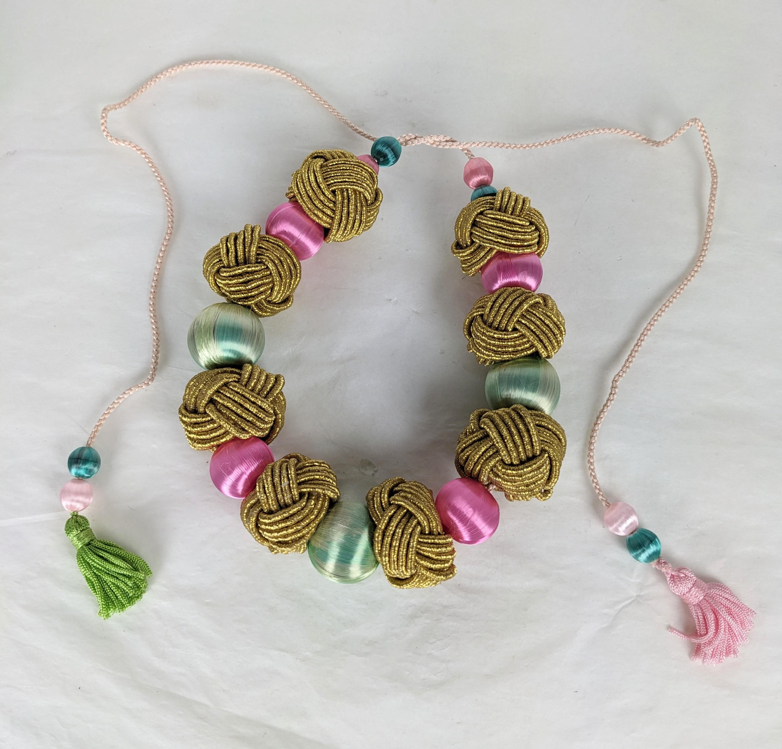 Yves Saint Laurent lavish Haute Couture  Passementerie Necklace, Fall Winter 1977, Chinese Opium Collection. Composed of silk cord with tassel ends. Gilt chinese passementrie knots, silk sateen large and small beads beads  imitating pale jade and
