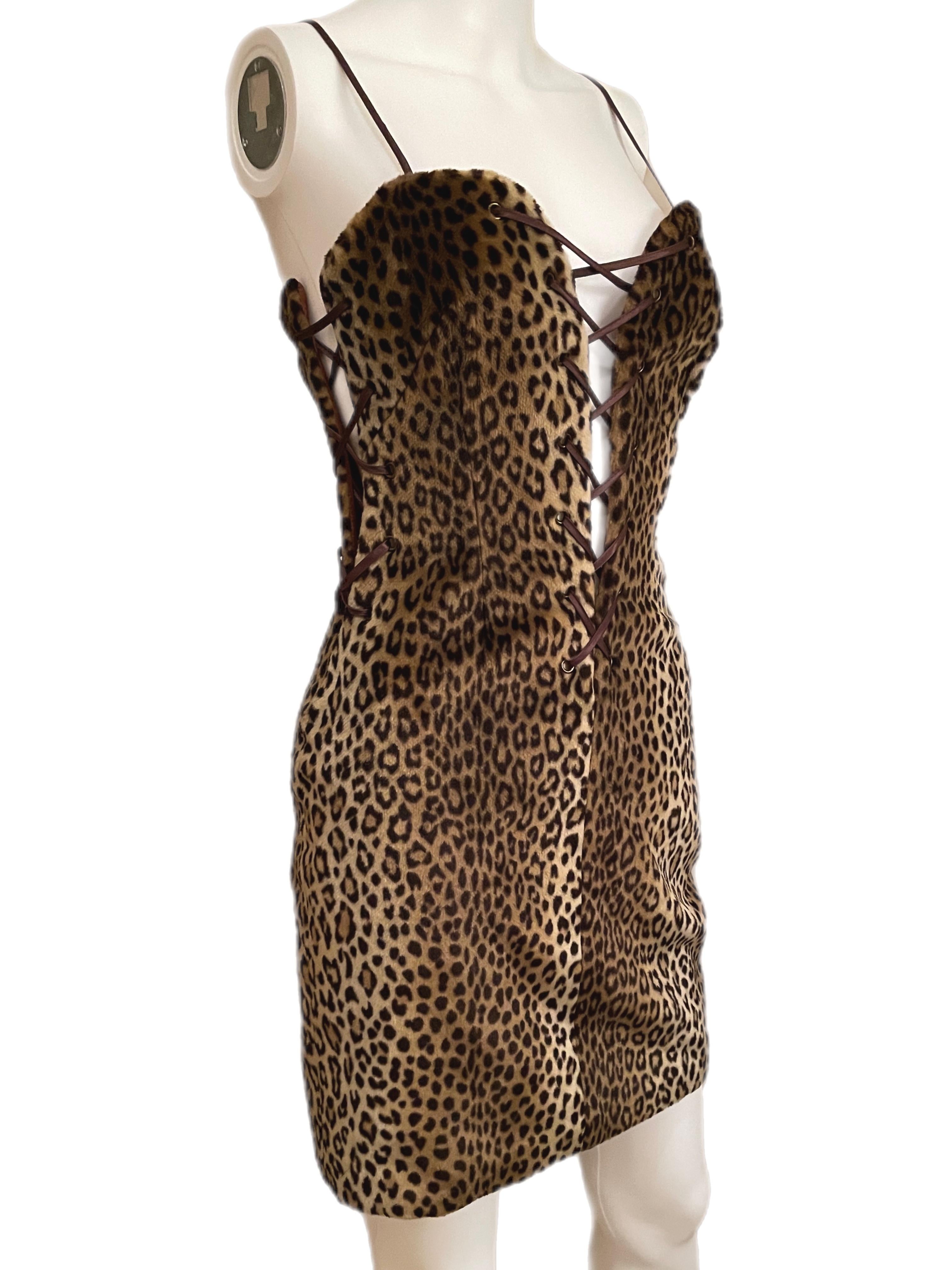 Yves Saint Laurent Variation leopard animal print mini dress with sweetheart plunge neck. Perfect condition, no flaws. Fits XS-M. The laces on the sides and in the front are totally adjustable. YSL. NO RETURNS FINAL SALE