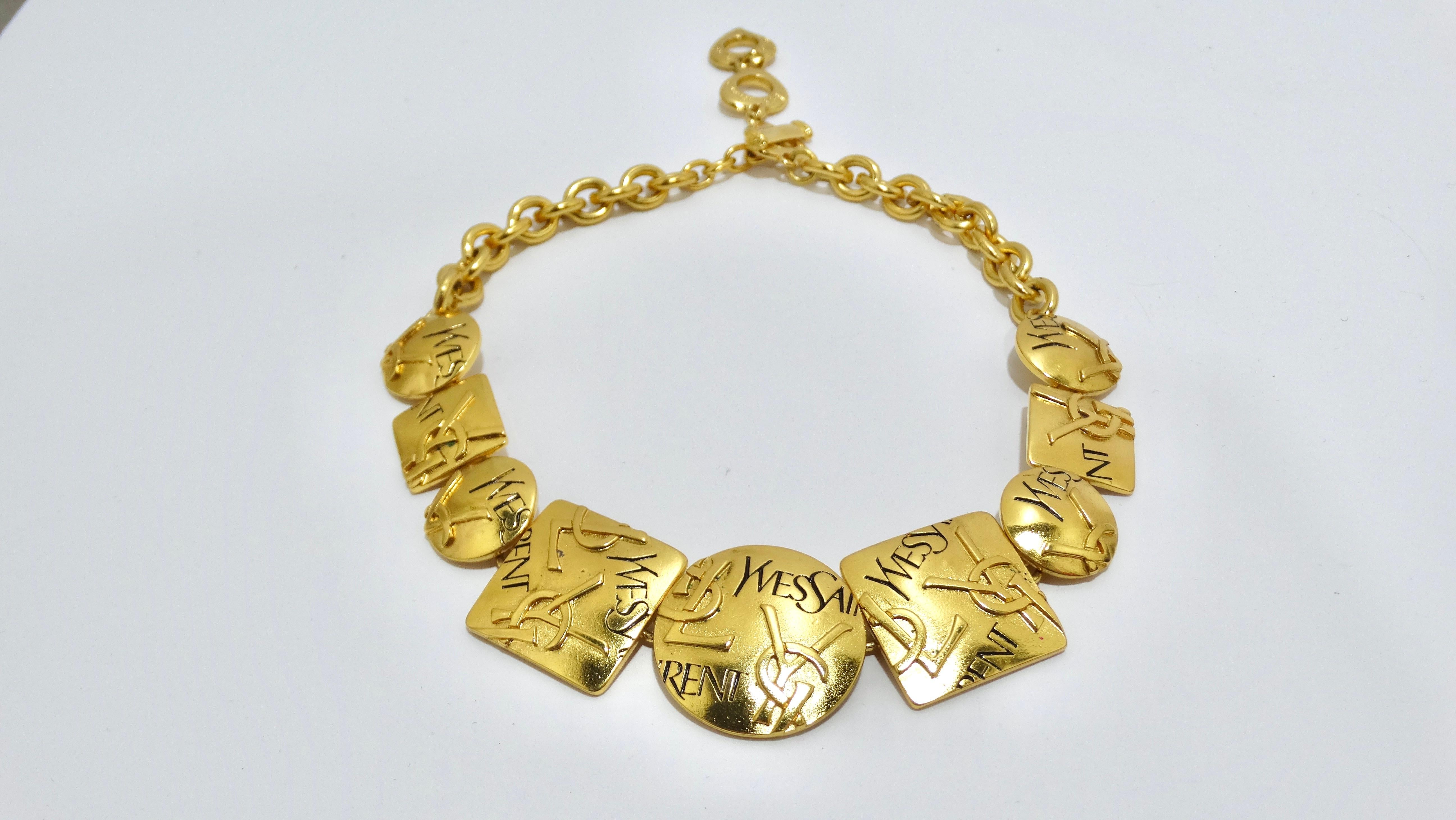 Don't miss out on this electric 80's piece of art! This Yves Saint Laurent necklace will bring out your edgy side. It features a full neckline of geometric shapes embossed and engraved with YSL initial logos. Signed 'YSL Made in France' on the
