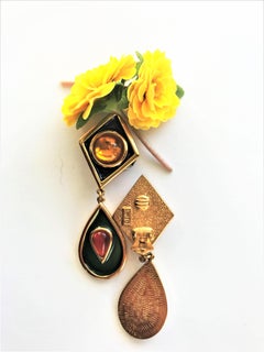 Yves Saint Laurent long ear clips gold plated  1980s, green enameled, glass ston