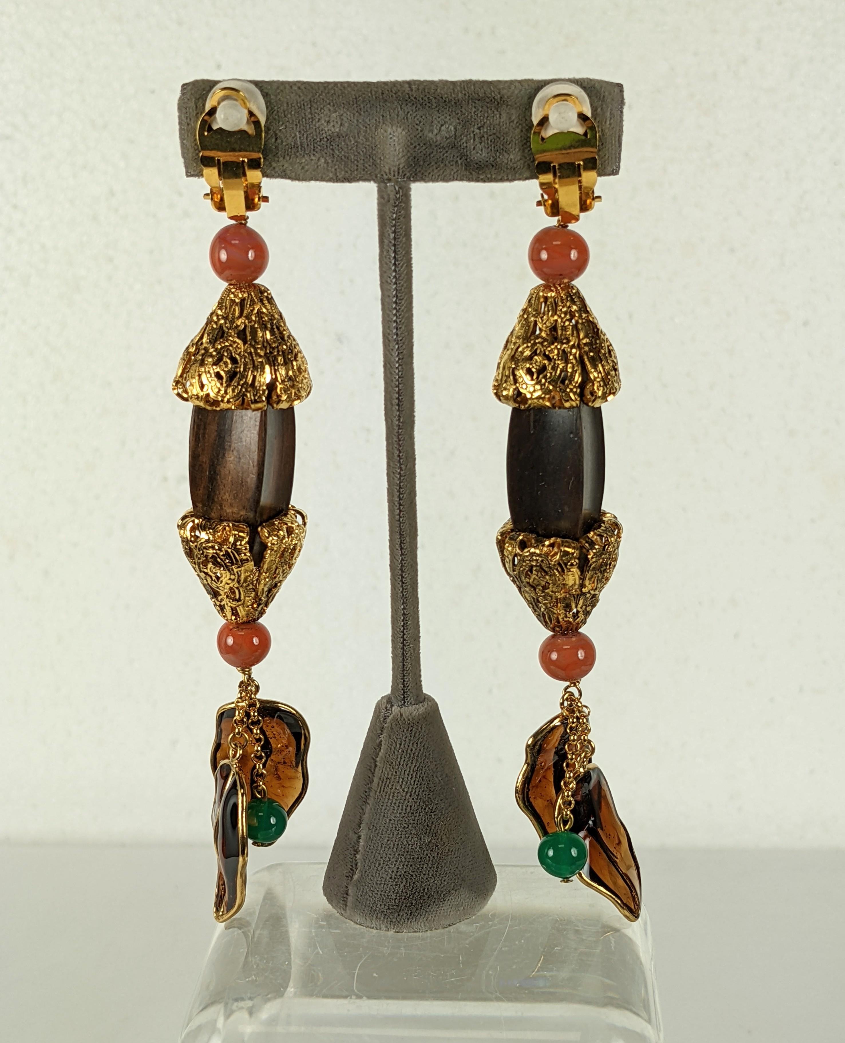 Rare Yves Saint Laurent by Maison Gripoix, Haute Couture, Fall Winter 1977 Chinese Opium Collection. Super long, hand made by Gripoix of poured glass enamel, gilt plated bronze and wood. The poured glass enamel in beads of coral and jade with dark