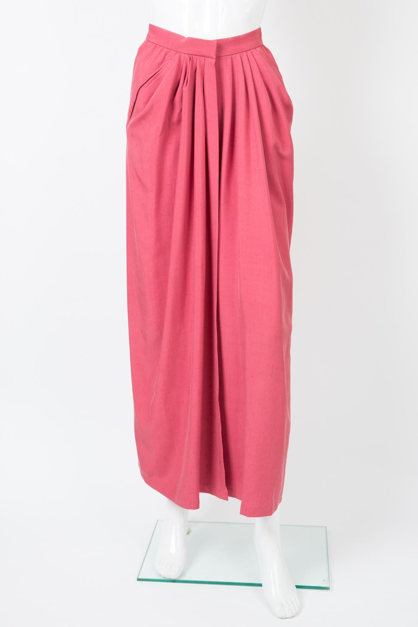 1980s Yves Saint Laurent maxi long pink silk skirt featuring a front opening with a hook & an inside button, front pleats, front bias pockets.
100% silk
In excellent vintage condition. Made in France. 
Label size 38fr but small waistband Estimated