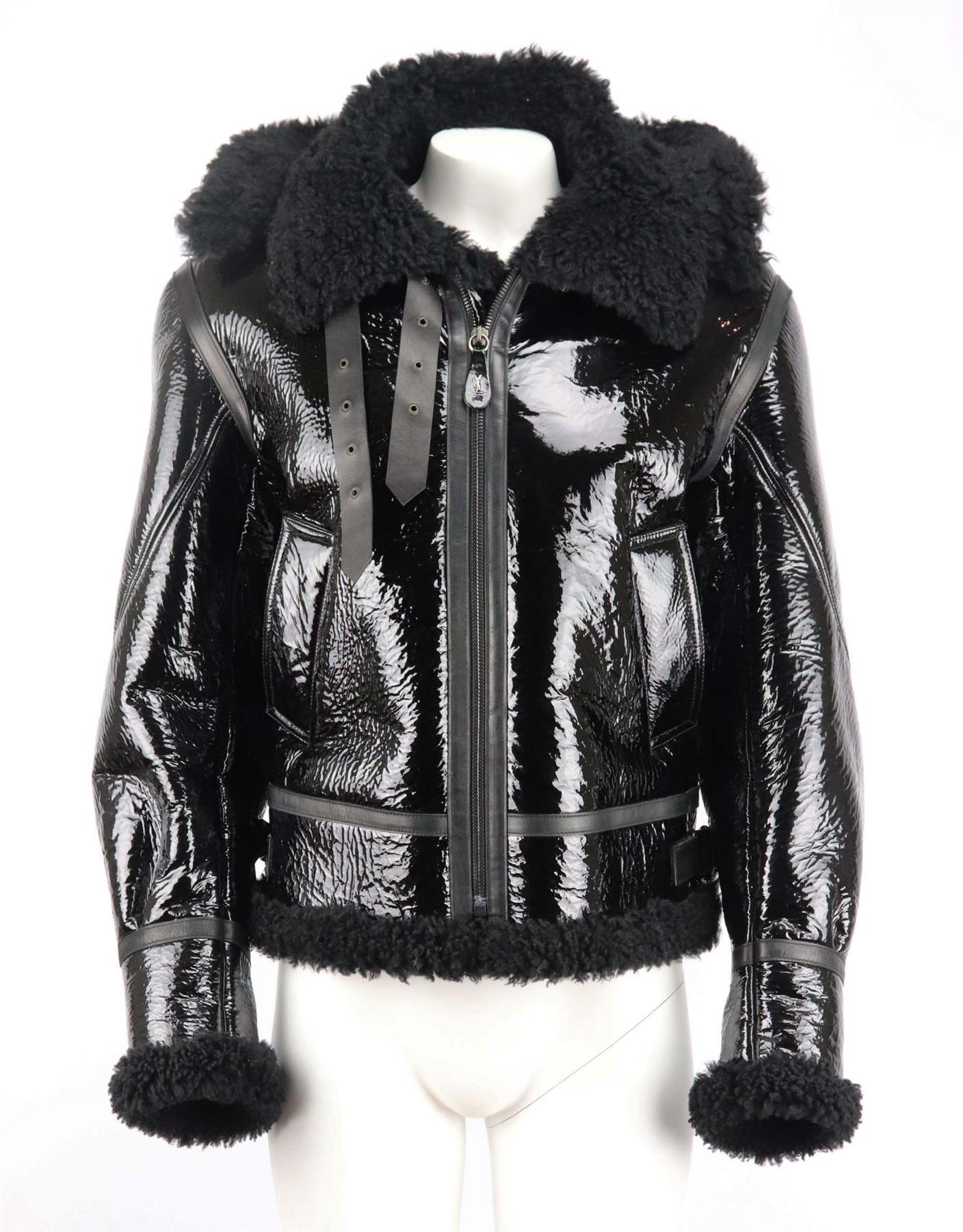 This men’s jacket by Yves Saint Laurent is made from shearling-lined vinyl with oversized pockets and lapels, a classic aviator jacket for your winter wardrobe. Black shearling, black vinyl. Zip fastening at front. 100% Shearling; pocket lining: