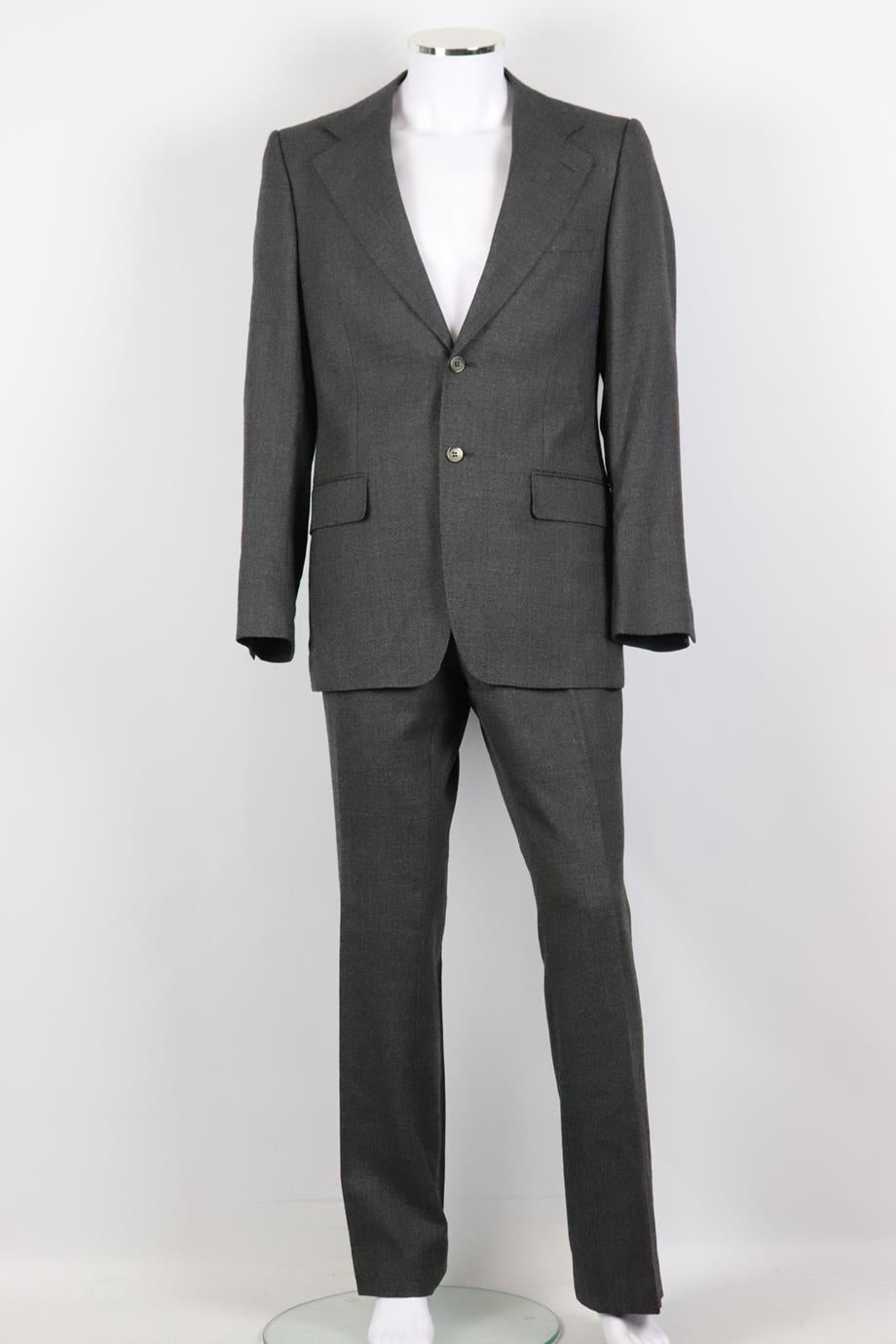 Yves Saint Laurent men's wool two piece suit. Grey. Long sleeve, v-neck. Button fastening at front, hook, eye and zip fastening at front. Jacket: 100% Wool; lining: 100% silk. Pants: 100% viscose. Size: IT 50 (Large, EU 50, UK/US Chest 40) Jacket: