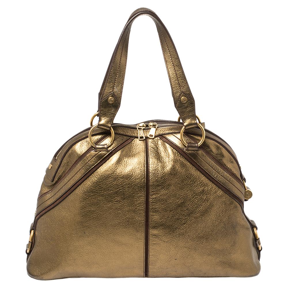 This Dome satchel by Saint Laurent has been crafted to assist you with ease and style on all days. It is sewn using leather and finished with gold-tone hardware. The bag features two handles and a spacious satin interior.

Includes: Padlock & Keys,