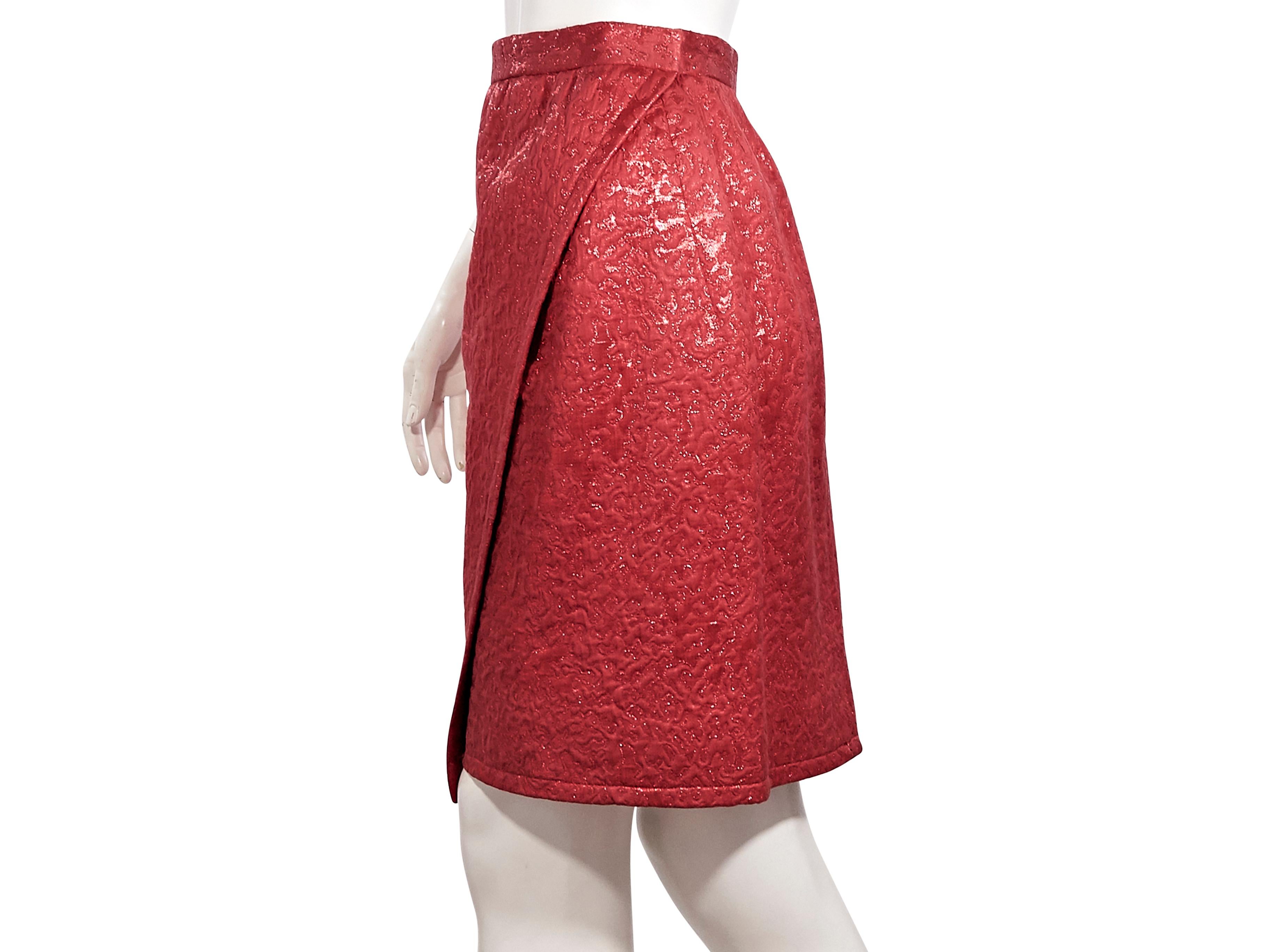Product details:  Vintage metallic red brocade wrap skirt by Yves Saint Laurent.  Circa the 1970s/1980s.  Banded waist.  Concealed hook closure.  Label size FR 40.  26