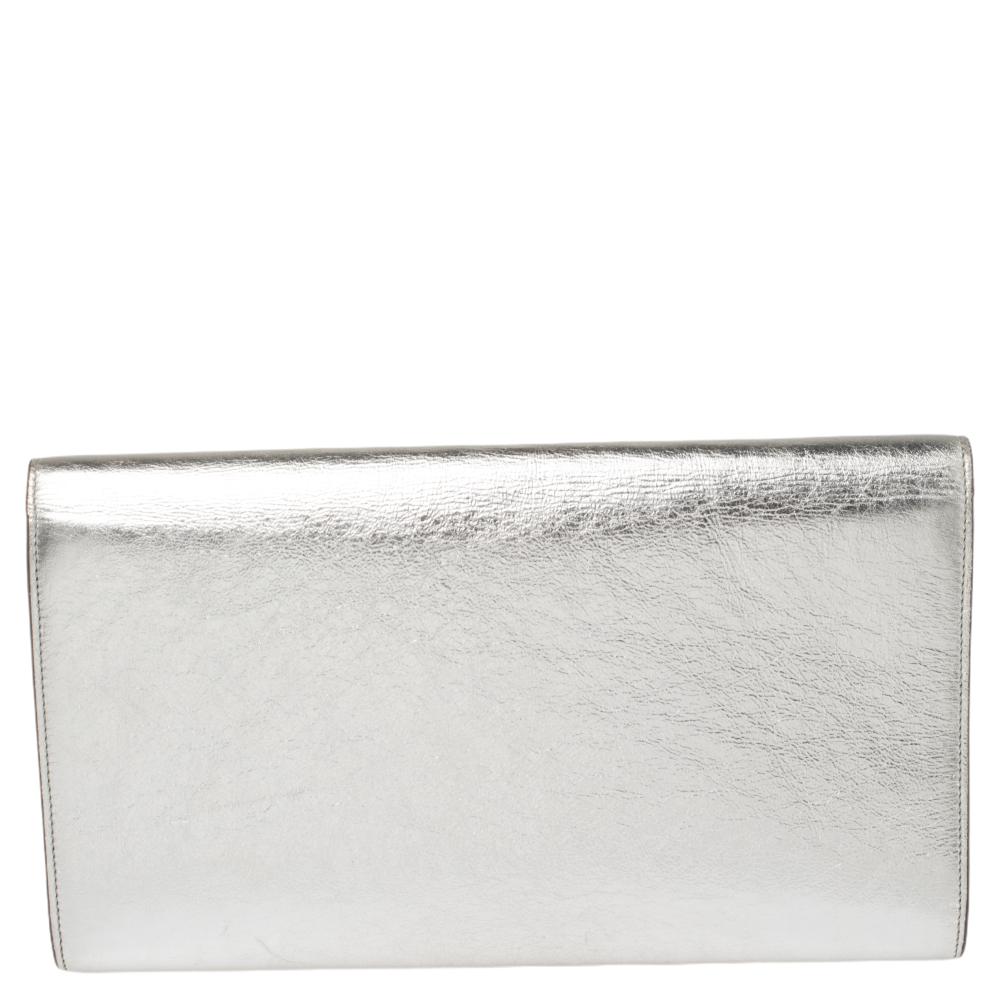 The Belle De Jour clutch by Saint Laurent is a creation that is not only stylish but also exceptionally well-made. It is a design that is simple and sophisticated, just right for the woman who embodies class in a modern way. Meticulously crafted