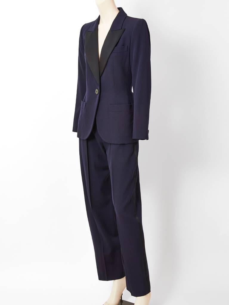 Yves Saint Laurent, Rive Gauche, midnight blue, wool,  tuxedo having a black satin notched collar, fitted silhouette, and single button closure. Straight leg trouser.