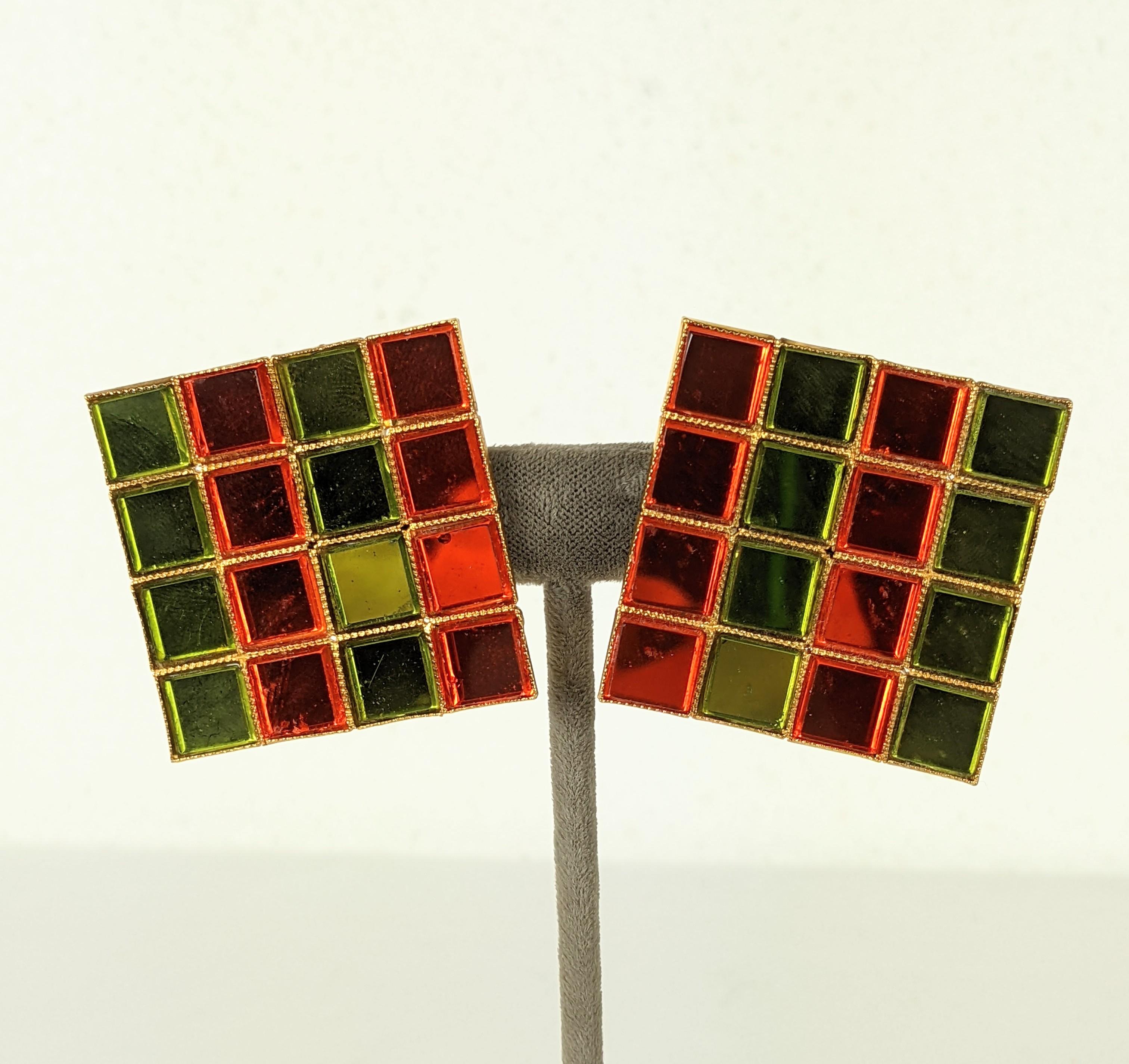 Yves Saint Laurent Mirror Tile Ear clips from the 1980's. Signature mirror tile stones in orange and olive used only by YSL for incredible graphic color.  Clip back fittings. 
1980's France,   1.75