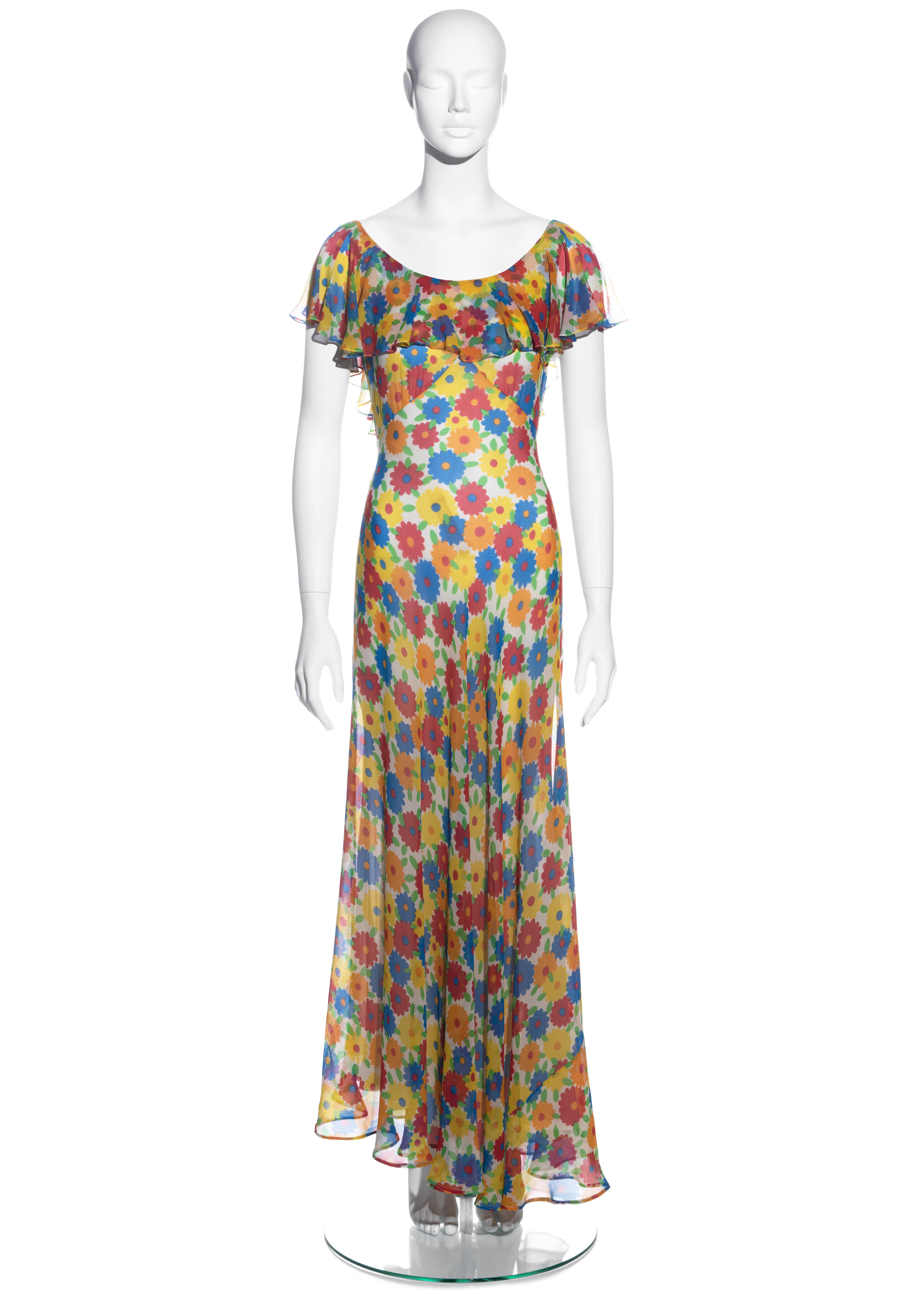 ▪ Yves Saint Laurent multicoloured maxi dress
▪ 100% Silk
▪ Red, blue, yellow, orange and green floral print with ivory base 
▪ Low back 
▪ Waist ties on waist 
▪ Zip fastening on side seam 
▪ FR 38 - UK 10 - US 6 
▪ Spring-Summer 1972