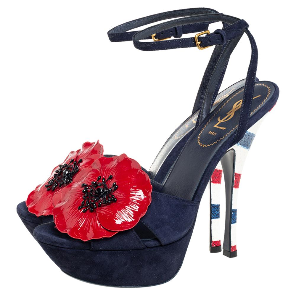 This pair by Yves Saint Laurent will complement your dresses and casual separates perfectly. The sandals are crafted from suede and decorated with blooming flowers on the uppers. They feature ankle straps with side buckle fastening, open toes, and