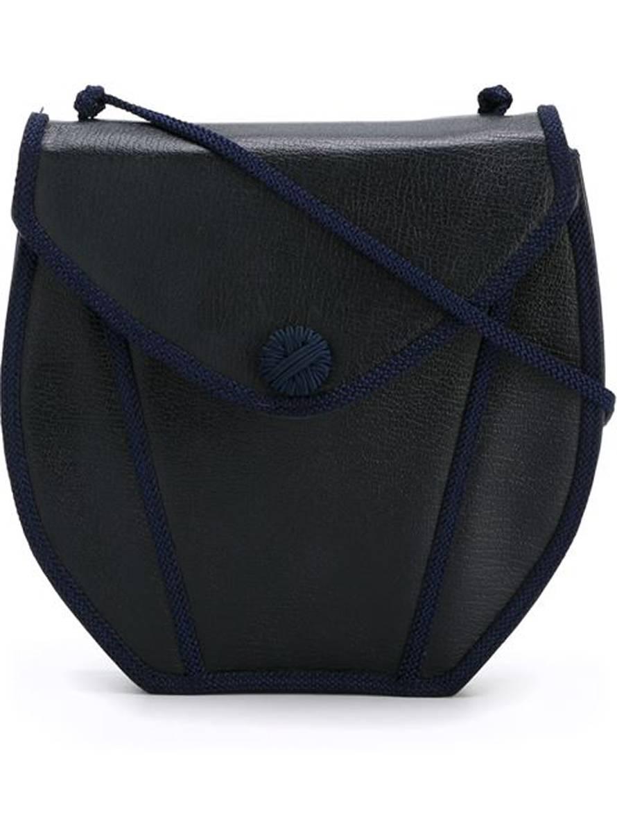 Yves Saint Laurent navy blue leather shoulder bag featuring a front metallic snap opening, navy braided details, a braided shoulder strap (Total length:41,3in. /105cm), an inside silk lining with an inside zipped pocket. 
In excellent vintage