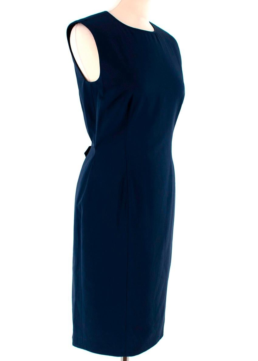 Yves Saint Laurent Navy Wool Sleeveless Shift Dress

- Lightweight navy wool dress
- Shift style 
- Sleeveless
- Midi length 
- Split back hem 
- Buttoned back panel 
- Darted front
- Concealed back zip and hook and eyelet fastening 

Materials: