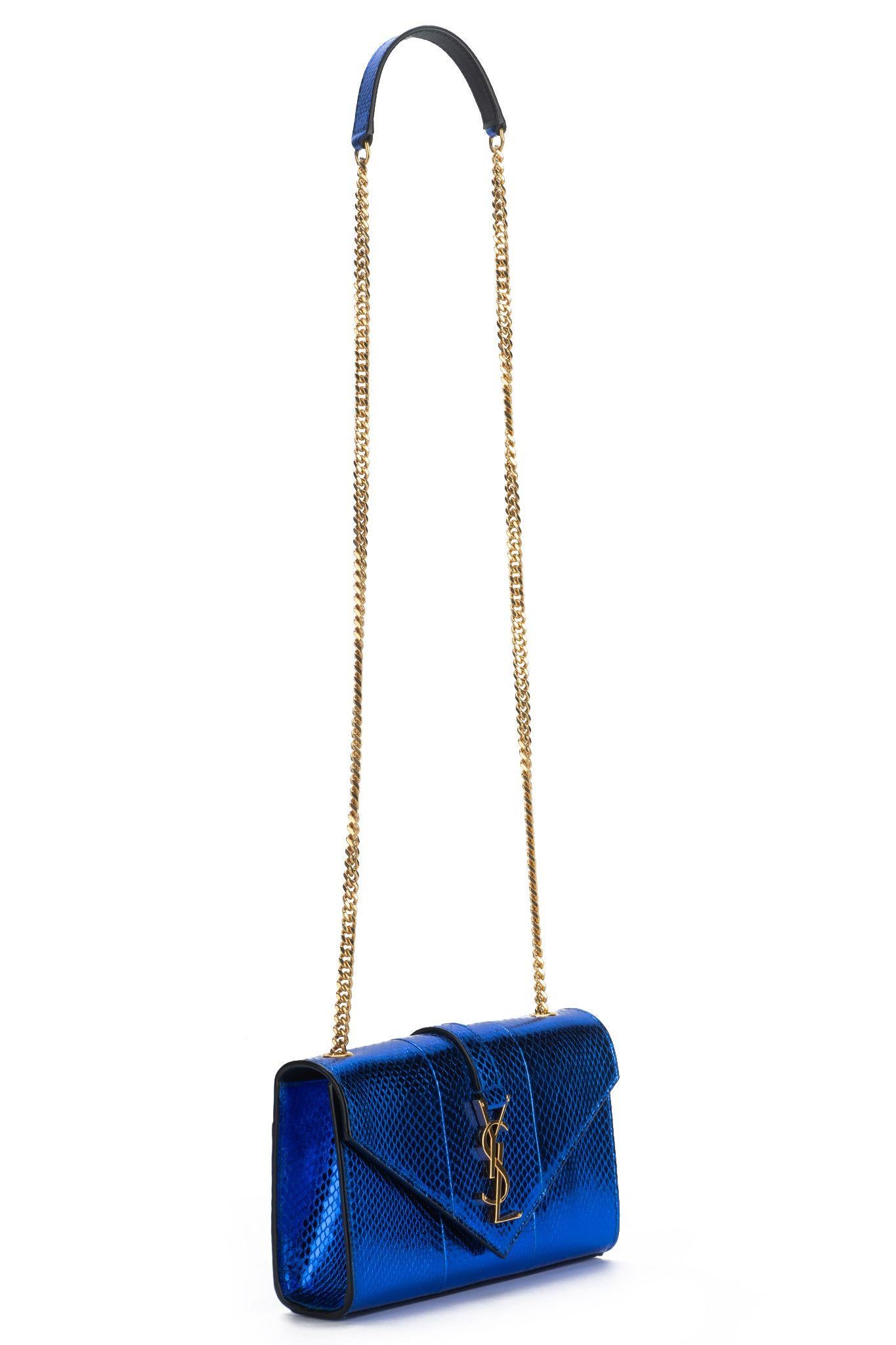 Yves Saint Laurent brand new electric blue python should bag with gold hardware. Can be worn cross body. Shoulder drop 22”. Comes with booklet, cites and original dust cover. 
Due to wild life regulations we do not sell to California residents.