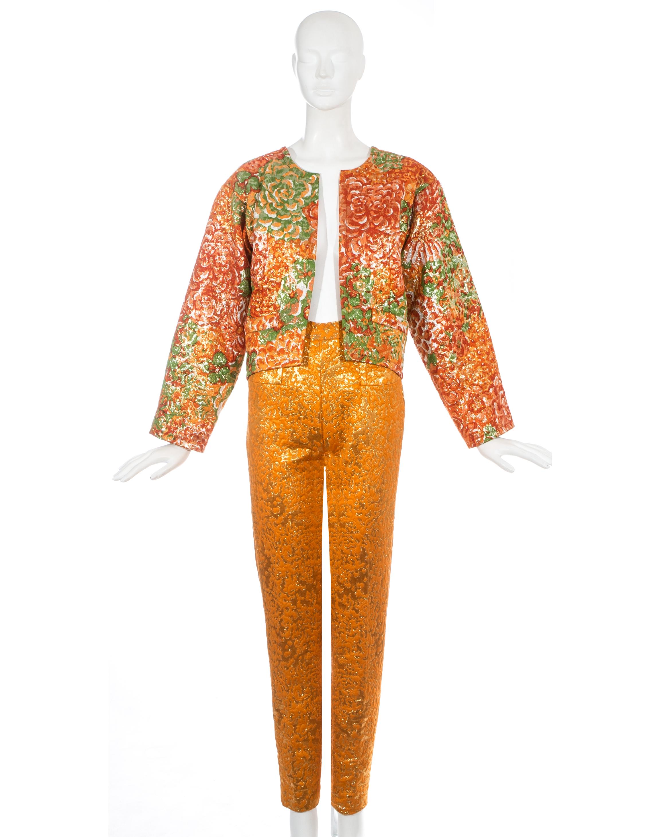 Yves Saint Laurent orange metallic brocade evening pant suit. Jacket has a boxy fit with no closures and green silk lining. High waisted slim fit pants.

Fall-Winter 1989