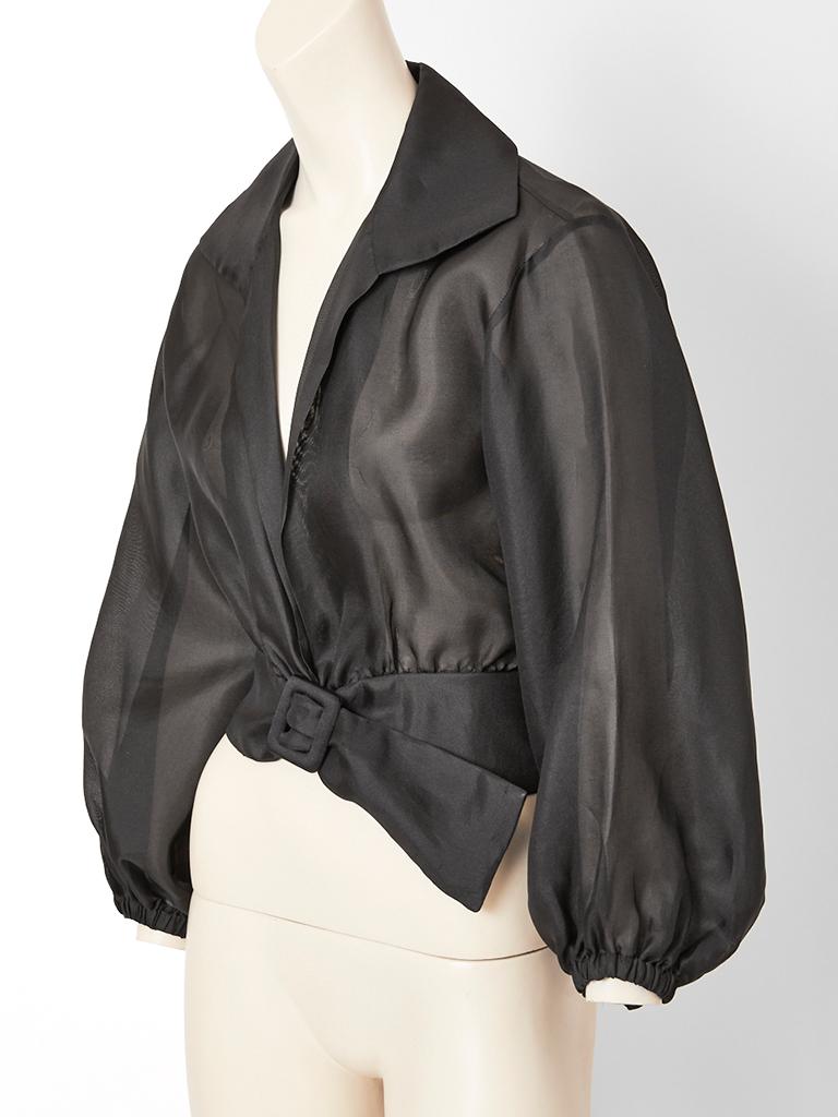Yves Saint Laurent,  rive gauche, black, sheer, organza, blouson, having a stand up  pointed collar with a deep open neckline. The blouse ends at the waist having an attached self, wide belt, sheer, balloon sleeves with elastic at the wrists.