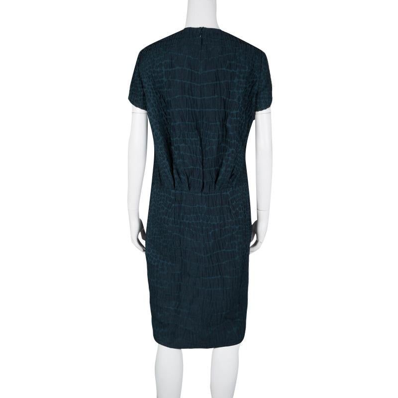 Laud the season with a remarkable dress like this wool-cotton blend piece. Go stronger with your everyday look in this dress that is secured with a zip. Coming from the house of Yves Saint Laurent, this dress is a classy piece to own. Prepping for a