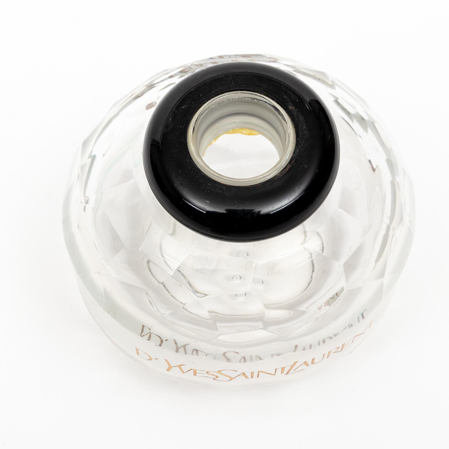 Circa 20th century Yves Saint Laurent Factice perfume bottle once used as a store display and does not contain perfume. Made in France. Please note of wear consistent with age.