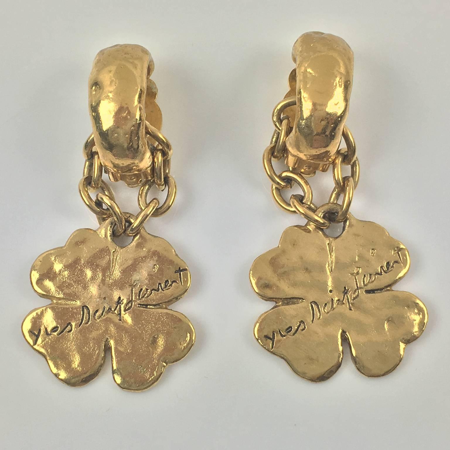 Yves Saint Laurent Paris Gilt Metal Clip on Earrings with Dangling Charm In Excellent Condition In Atlanta, GA